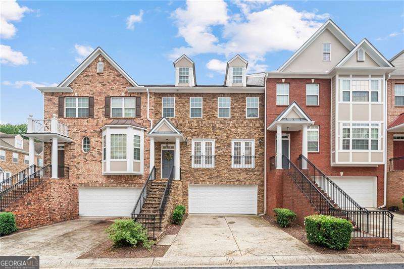 PRIME LOCATION ! AWARD WINNING SCHOOLS ! Welcome Home to this gorgeous Townhome in the popular Abbotts Bridge Place community located in the heart of Johns Creek City. This well maintained 4 bedroom, 3.5 bath unit with a fully finished basement is tucked in a secure, amenity-rich, family friendly gated community. RECENT UPGRADES- NEW DECK (2025), NEW HVAC (2025), NEW WATER HEATER (2025), NEW GARAGE DOOR (2025), NEW TOILETS THROUGHOUT (2025), NEW INTERIOR PAINT (2024), NEW RECESS LIGHTING THROUGHOUT THE HOUSE (2025). This spacious home features hardwood floors on the main level, large dining room, wrap around kitchen that is perfect for cooking & entertaining, a double sided fireplace that connects the kitchen to the family room. Abundant windows fill the home with tons of natural light, enhancing the warm and inviting atmosphere. The Owner's suite features an oversized bedroom with a soaking tub, double vanities, large shower, and a huge walk-in closet. Laundry room is conveniently located on the upper level with easy access to all bedrooms. Fully finished daylight terrace level has a massive room big enough to be used either as a bedroom with a sitting area or as a media/ hobby room. Finished basement features on-suite bath, walk-in closet, and a door to the outdoor patio area. Community offers full size amenities including swim, tennis, a dog park, playground, and a small lake, offering a lifestyle of comfort and convenience. The over-sized deck and cozy patio will be lovely to enjoy your morning coffee or evening wine with grilling outside.This Home is in a very family friendly neighborhood with lots of children around and multiple visitor parking areas for guests to park. It is move-in ready house with easy access to GA 400, 141 Peachtree parkway and just minutes away from Avalon and Halcyon's premier shopping, H-Mart, Cauley Creek Park, Emory Hospital, Library, Schools, Restaurants and many more. The new upcoming/ very exciting premium project of Johns Creek- "The Medley at Johns Creek " will be walking distance to this community. This House-A Must See Beauty... Won't Last Long...So Hurry !!