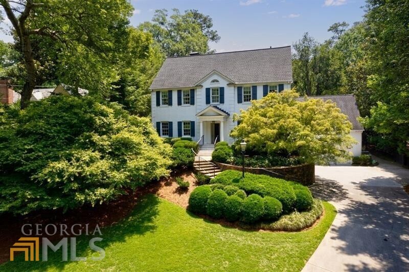 This beautifully renovated 1930's quintessential Buckhead home sits on 1.13+/- acres. Entrance foyer leads to formal dining room and living room with fireplace. Cozy wood paneled den has fireplace and built-ins. The kitchen was thoughtfully renovated and offers marble counters with matching island, Miele steam oven, Thermador range/oven and warming drawer. Charming banquet breakfast area. Kitchen opens to the family room with built ins and overlooks the backyard. Large office with full bath, could also be used an a guest suite on main. Upper level offers 4 bedrooms and 3 baths, including primary bedroom. Primary bath has a steam shower. Basement has bedroom, full bath, laundry, built in bar, living room and wine cellar. The manicured grounds are truly breathtaking! Gorgeous saltwater pool, covered cabana with kitchen, full bath and fireplace. The level backyard can fit a sport court. 8 camera closed circuit security system and full house generator.