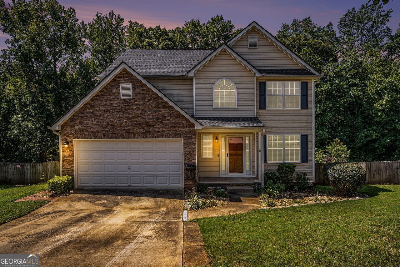 Welcome to 308 Stallings Drive - A Home Designed for Comfort, Style, and Space! This beautifully updated 4-bedroom, 2 full bath, and 2 half bath home offers the perfect blend of functionality and charm, with room for everyone and every occasion. From the moment you arrive, the curb appeal sets the tone-stone and siding accents, a welcoming front porch, and a brand-new roof give this home both style and peace of mind. Step inside and you'll find a warm, open layout filled with natural light. The main living area boasts a cozy fireplace, neutral finishes, and sightlines into the dining area and kitchen. The kitchen features crisp white cabinetry, stainless steel appliances, and plenty of counter space, making it a true centerpiece for everyday living and entertaining. Upstairs, three spacious bedrooms offer comfort and versatility. The primary suite is a true retreat with a walk-in closet and a private bath featuring a soaking tub and separate shower. A full laundry room on this level adds convenience. Downstairs, the fully finished basement is a showstopper. With new luxury vinyl plank flooring, a half bath, a private bedroom, and multiple flexible spaces, it's perfect for a guest suite, media area, home gym, or office. Direct walk-out access leads you to the fenced backyard, where you'll find even more space to enjoy. The newly redone deck, complete with stairs to the yard below, provides the perfect backdrop for morning coffee, evening grilling, or hosting friends. Add in a large two-car garage and ample storage throughout, and this home checks all the boxes. Key features include a brand-new roof, four bedrooms, two full bathrooms plus two half bathrooms, a finished basement with bedroom and walk-out entry, new luxury vinyl plank flooring in the basement, a newly rebuilt deck with stairs, a spacious two-car garage, a fireplace in the main living room, and a full laundry room upstairs. And here's the bonus: Seller will contribute $10,000 with a full-price offer, giving you extra flexibility to make this home truly yours. Don't miss the chance to own this move-in ready gem that combines classic design, smart updates, and all the space you've been looking for. Schedule your showing today and see why 308 Stallings Drive should be your next address!