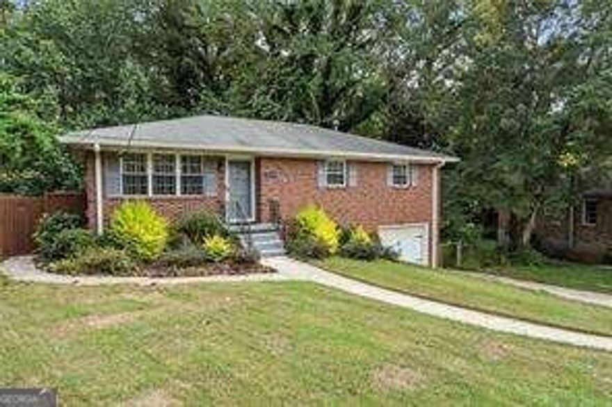 Welcome to this beautifully maintained 4 bedroom, 2.5 bath ranch in the heart of Smyrna. Located in a quiet, established neighborhood, this home offers convenience and comfort with easy access to the East-West Connector, Silver Comet Trail, Truist Park, shopping, and top dining options.  Inside, you will find a bright and open layout featuring hardwood floors throughout the main living areas, an updated kitchen with stainless steel appliances, stone countertops, and plenty of cabinet space. The primary suite includes a private bath with step-in shower, while two additional bedrooms provide flexible space for guests or a home office.  Enjoy the large, level backyard perfect for relaxing, entertaining, or a pet-friendly play area. A rear deck offers a great spot for grilling and outdoor dining. Attached carport and additional driveway parking make everyday living simple.  Come enjoy all that Smyrna living has to offer at 3235 Woodview Dr.