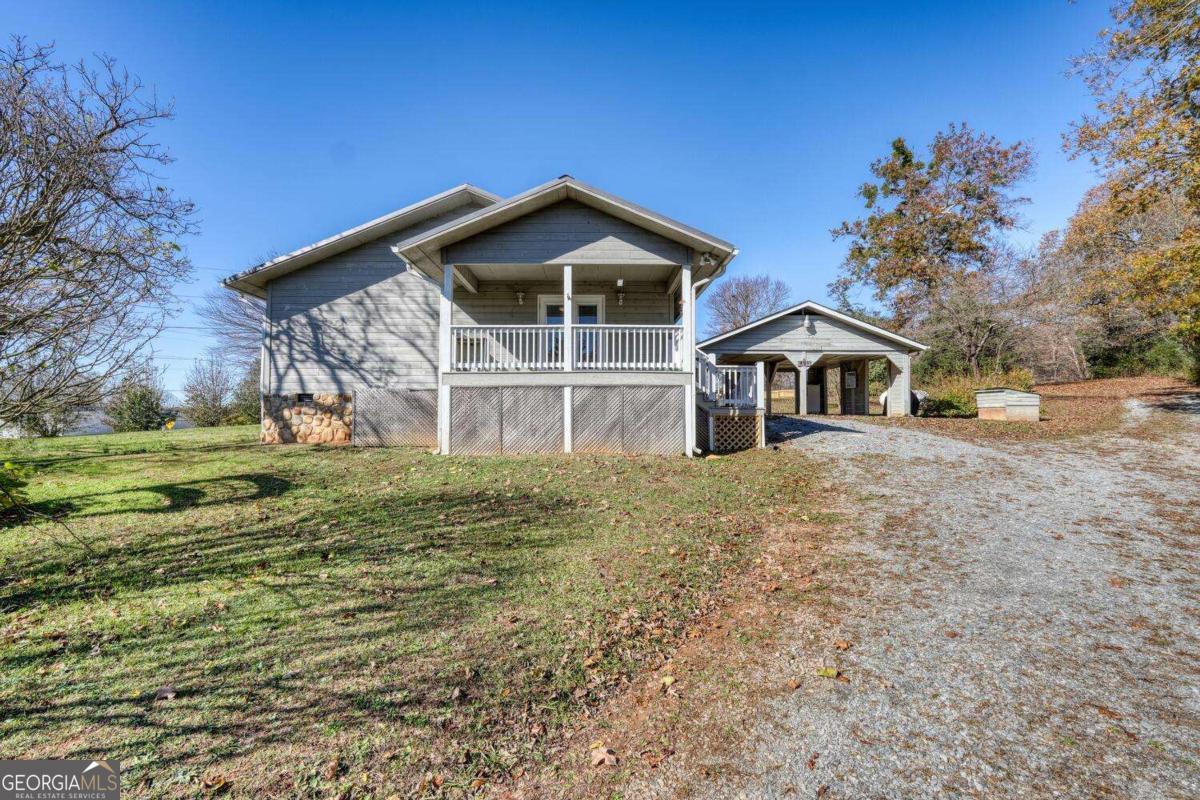 Welcome Home to 431 Clear Creek Rd, where comfort meets convenience in this beautifully appointed home. With 4 spacious bedrooms and 3 well-designed bathrooms, this property offers ample space for families and those who love to entertain. You'll appreciate the large master suite that serves as a private retreat, ensuring relaxation at the end of each day. The outdoor space is equally impressive, boasting porches galore that invite you to unwind with a morning coffee or host weekend gatherings. Additional features such as a dual-car carport, workshop, and storage building cater to all your practical needs, adding versatility to your lifestyle. The inclusion of a handicap ramp enhances accessibility, making this home welcoming for everyone. Situated just a stone's throw from the Gilmer Recreation baseball fields, this home's location is perfect for sports enthusiasts and active families. The property is also conveniently close to local schools, ensuring your children have easy access to quality education. Nearby churches add to the sense of community and support in this friendly neighborhood. With both charm and convenience, 431 Clear Creek Rd is more than just a house-it's a place to make lasting memories. Don't miss out on the opportunity to own this delightful property.