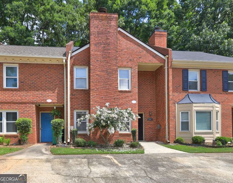Welcome to 3153 Corner Oak Drive, a charming and move-in-ready townhome nestled in the desirable Corner Oak community of Peachtree Corners. This 2-bedroom, 2.5-bath residence offers an ideal blend of comfort, convenience, and low-maintenance living. Step inside to discover a bright and open main level featuring a spacious living room with a cozy brick fireplace, perfect for relaxing or entertaining. The adjacent dining area flows seamlessly into a functional kitchen equipped with essential appliances and ample cabinet space. A convenient half bath on the main floor adds practicality for everyday living. Upstairs, you'll find two generously sized bedrooms, each with its own private fully renovated bathroom and plenty of closet space-perfect for creating personal retreats or accommodating guests. Luxury vinyl plank flooring on the main level and soft carpeting upstairs offer a balanced mix of style and comfort. Outside, enjoy a quiet patio area ideal for morning coffee or evening unwinding. Additional storage is available for seasonal items or hobby equipment. All of the flooring in the home was replaced in April of 2025. This home is part of a well-maintained brick-front townhome community with a modest HOA and a strong neighborhood feel. Located just minutes from Peachtree Corners Town Center, The Forum, and Historic Norcross, you'll enjoy easy access to shopping, dining, and entertainment. Commuters will appreciate the quick routes to major highways, while families benefit from zoning to Norcross Elementary, Summerour Middle, and Norcross High. Whether you're a first-time buyer, looking for a better commute, or looking to downsize, 3153 Corner Oak Drive is a must-see opportunity in a prime location. Schedule your tour today!