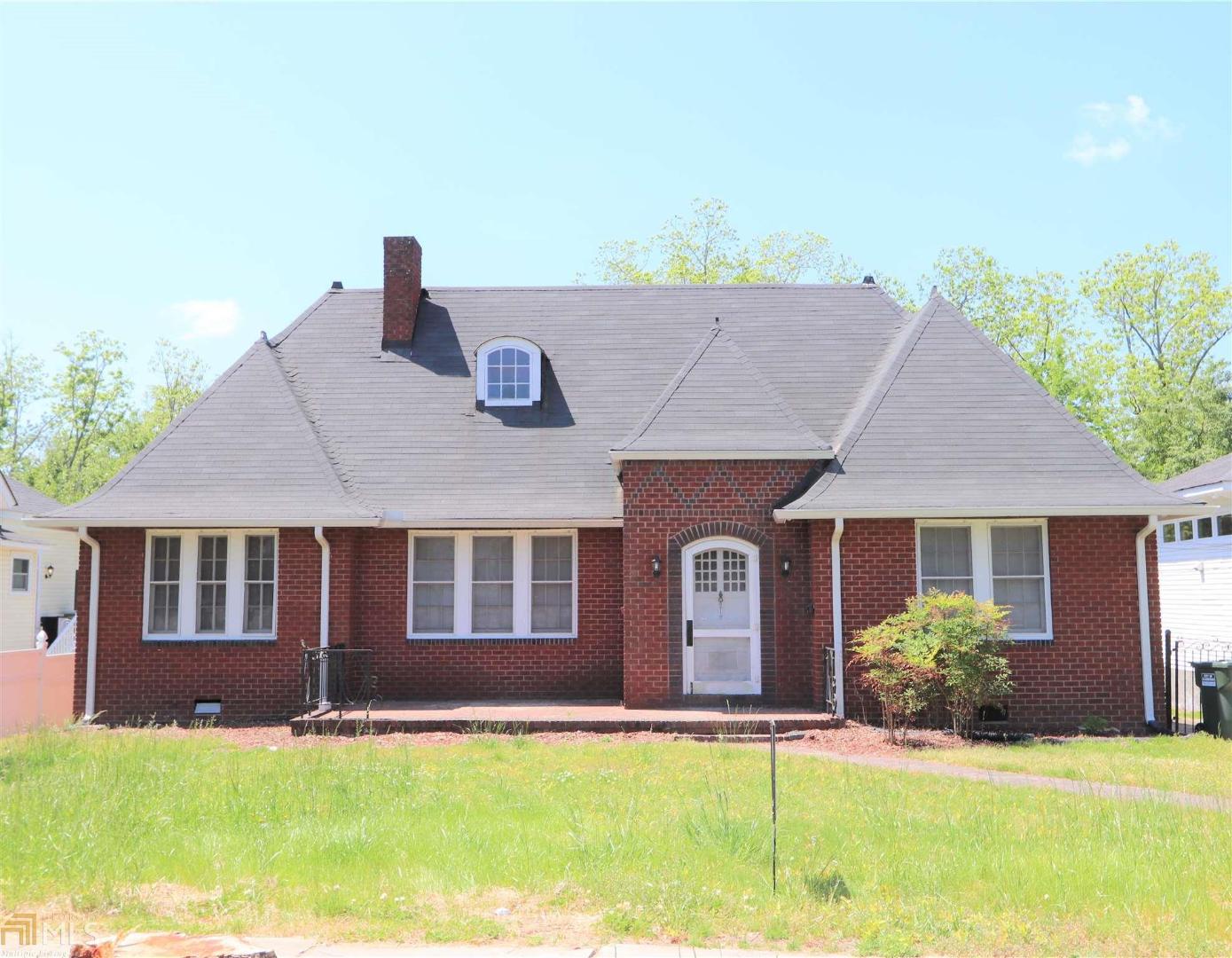 Charming tudor style home in the Historic District of Elberton! Amazing character throughout, including large & spacious rooms with hardwood floors, glass door knobs, separate/formal dining room, butlers pantry/breakfast room and kitchen that is ready for your personal touches to make it your own. Upstairs has an additional bonus room that could be used as 4th bedroom - needs hvac upstairs but ideal for extra space. All brick in a great location, convenient to everything. Home does need some tlc - Call today!