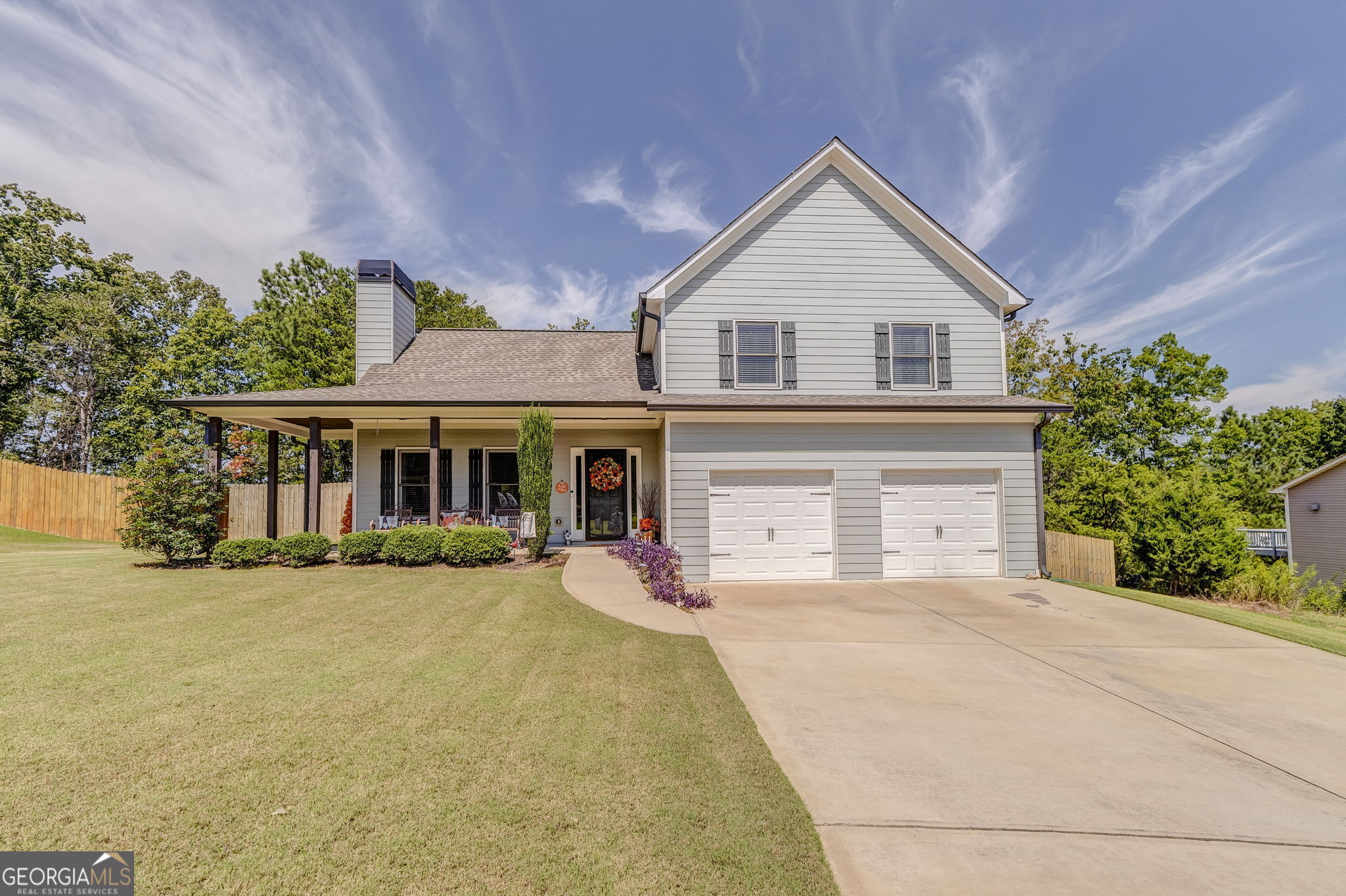 USDA eligible! Welcome to your new home that merges open-concept living with elegant, low-maintenance design, nestled in a thriving community in Rockmart, GA. This 1900sf (approx) 4-bedroom, 2.5-bathroom gem sits on a generous 0.35acre lot in Rockmart's beloved swim/tennis Arbor Chase subdivision. Step through the welcoming front porch into an inviting great room that flows into the kitchen and dining areas. Rich hardwood floors stretch beneath your feet-from the heart of the home in the kitchen to the communal spaces-each step whispers warmth and quality. The kitchen shines with gleaming granite countertops, a stylish tile backsplash, and stainless appliances, setting the stage for culinary adventures and gatherings alike. Every bathroom continues the theme of sophistication with granite surfaces and durable tile underfoot. Retreat upstairs to your private sanctuary. The owner's suite boasts tray ceilings that lend grandeur, a capacious walk-in closet, and a layout made for relaxation. The home's architecture blends beauty with practicality: cement siding lends durability, while the composition roof ensures longevity and peace of mind-designed for both aesthetic appeal and ease of upkeep. Outside, the covered patio overlooks a backyard that's yours to personalize-a perfect setting for evening grilling or quiet morning coffee. With ample space on the half-acre, there's room to create a garden, play area, or serene retreat. The neighborhood feel remains strong, with gathering space aplenty at the community pool, tennis/pickle ball courts, picnic area and playground, fostering friendships and childhood memories. At just $400 per year, the HOA fee ensures these amenities remain pristine without breaking the bank.
