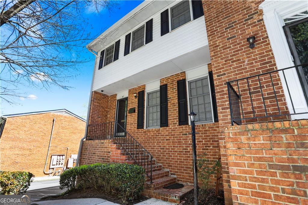 Fantastic Investment Opportunity in Sandy Springs Townhome Seize this incredible deal at 6250 Roswell Rd, Sandy Springs, GA, listed at $275,000! This beautifully renovated, spacious townhome in the gated Townhomes of Sandy Springs community is a rare find, offering guaranteed rental income with a Section 8 tenant in place as of June 23, 2025, providing $2,900 monthly through April 30, 2026. For owner-occupants, the tenant can be given a 60-day notice to vacate, offering flexibility for any buyer. This well-maintained two-story townhome welcomes you with a charming front garden and a grand two-story foyer featuring luxury flooring. The sunlit family room, perfect for oversized furniture, flows into a formal dining room and a delightful back patio deck. The stunning kitchen boasts granite countertops, abundant cabinetry, upgraded appliances, and a convenient adjacent laundry closet with included washer and dryer. Upstairs, the spacious owner's suite impresses with an updated private bath and oversized closet, complemented by two additional bedrooms with ample storage and a modern hallway bath with new vanities. The home features plush carpeting and fresh updates throughout. The Townhomes of Sandy Springs community offers a gated entry, a lovely courtyard with BBQ area, ample guest parking, and meticulously landscaped grounds. Located just a short stroll from City Springs' entertainment center, including an outdoor concert amphitheater and Farmers Market, this home is surrounded by countless restaurants, retail, and grocery options like Trader Joe's, Whole Foods, Kroger, and Publix. Top-rated schools include Spalding Drive Elementary, Ridgeview Charter, and Riverwood International Charter High School. Don't miss this turnkey investment or future dream home in the heart of Sandy Springs! Gate code provided with confirmed appointment.