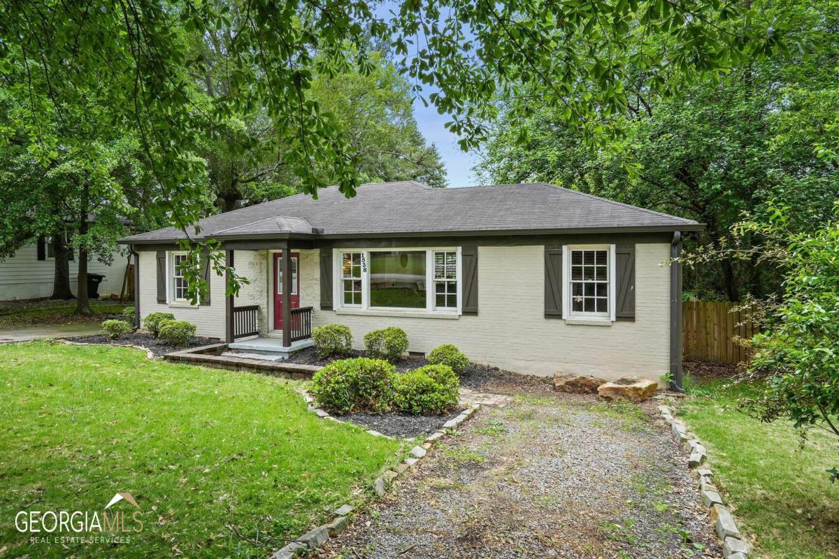 If you run a business out of your home, then you'll want to keep reading as this rare property is zoned for both residential and commercial use. Whether you're looking to make this place a homestead or have big entrepreneurial plans, this 3/2 ranch offers a multitude of opportunities. The spacious kitchen with ample counter and cabinet space, a deep farmhouse sink, and open shelving is great for entertaining or being used as a commercial kitchen for your next baking business. The bedrooms are versatile and can be used for hosting guests, a home office, an art studio, or even a video game room. The backyard offers plenty of space and includes additional paved parking and a two-story shed, perfect for working on vehicles, storing gardening equipment, or creating an at-home workshop. If the endless opportunities within the home weren't enticing enough, the possibilities outside of the home are equally impressive. This property is located less than 2 miles from the Marietta Square, which offers a variety of establishments ranging from locally-owned restaurants to boutique retailers and craft breweries. It also hosts weekend festivals, art walks, and local performances. Seize this opportunity while you can!