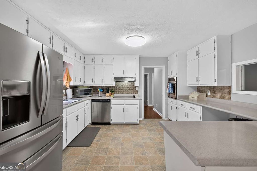 Photo of 1561 Bentwood Drive SW, Lilburn, GA 30047 (MLS # 10800903)