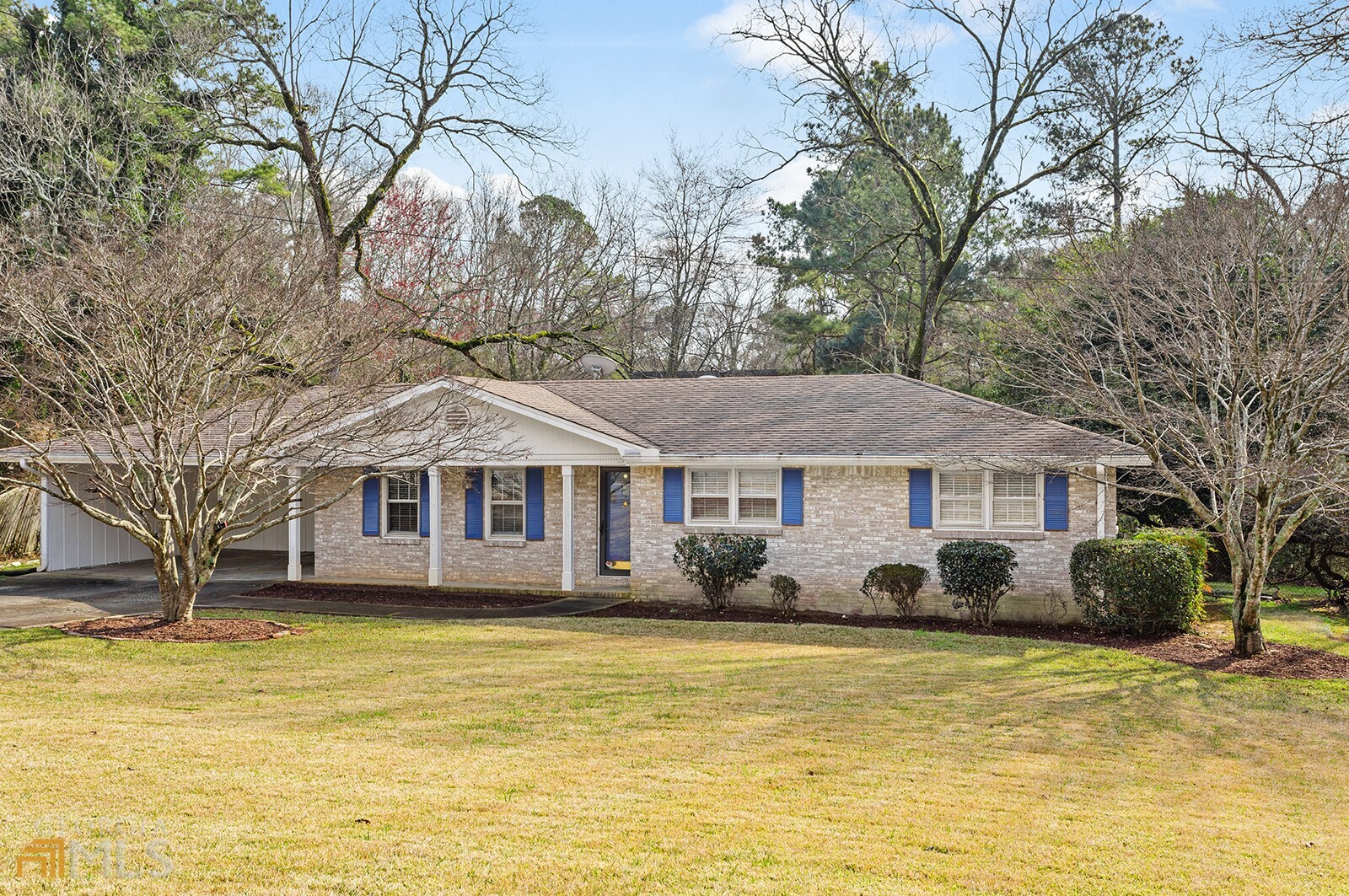 Fabulous New Listing in Stn Mtn / Lilburn Location! Parkview Dist! Brick Ranch w/ Hardwood Floors thru-out! Living Room / Dining Room, Den w/ Brick FP! Open Kitchen w/ SS Appliances & Updated Light Fixtures! Laundry Room, 3 Bedrooms and 2 Tile Baths! Covered Rear Porch! 2 Car Carport. Large Level & Wooded Fenced Back Yard! NO HOA! Convenient to Stone Mountain & Shoppes / Tucker & Decatur!