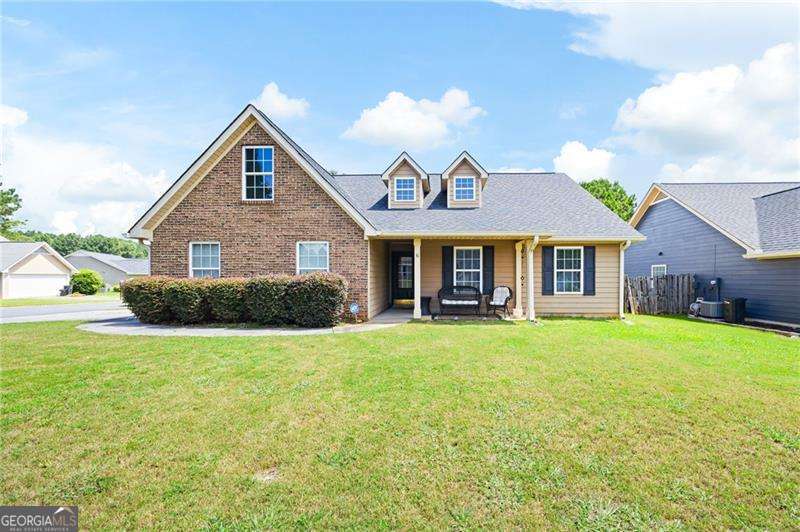 Welcome to this well-maintained 3-bedroom, 2-bath ranch-style home on a spacious corner lot in a quiet, friendly community-just minutes from Berry College, downtown Rome, and the Braves stadium! This home has been truly loved, and it shows-featuring fresh interior paint, newer carpet, and an open-concept layout that offers a warm and inviting feel. Everything is conveniently located on one level, including the spacious primary suite and two additional bedrooms. The large kitchen flows into a separate dining room, making it perfect for both everyday meals and special gatherings. You'll love the bonus sunroom-ideal for relaxing, reading, or working from home. Step outside to enjoy a fenced-in backyard, perfect for outdoor enjoyment and privacy. The 2-car garage adds great storage and convenience. If you're looking for easy, low-maintenance living with thoughtful updates and a fantastic location, this home is a must-see!