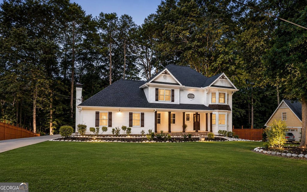 Photo of 557 Daisy Nash Drive SW, Lilburn, GA 30047 (MLS # 10818452)