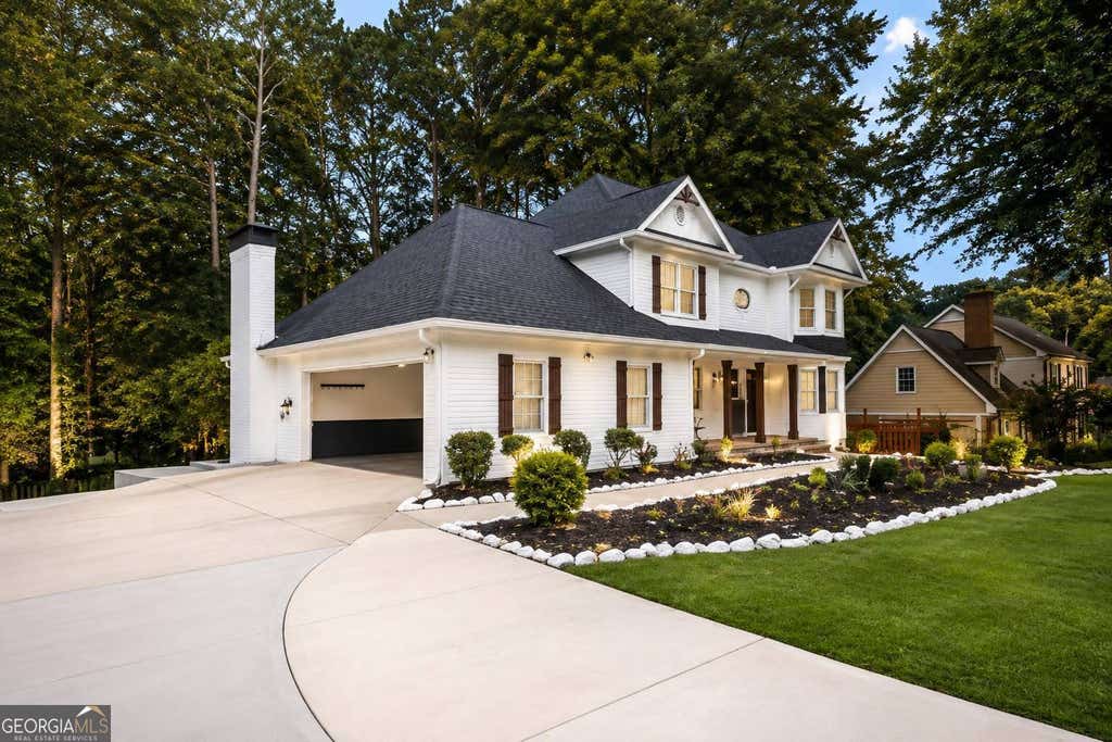Photo of 557 Daisy Nash Drive SW, Lilburn, GA 30047 (MLS # 10818452)