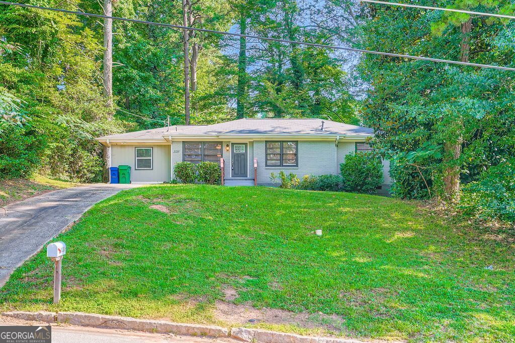 Come home to this 4-bed/2-bath single-family ranch-style home in cozy Belvedere Gardens, located just next to Memorial Dr and close to I-285. This ideal location is close to everything but still enjoys its comfortable suburban nature. The interior features an open floor plan. The kitchen comes equipped with stainless steel appliances such as a refrigerator, electric stove, microwave and dishwasher, complemented by granite countertops, white cabinets, a kitchen island that can serve as a small breakfast bar, and a good view of the family room. The master bedroom has an ensuite bathroom and walk-in closet. The laundry room has a washer/dryer available for tenant use but is not covered by the lease. Polished hardwood flooring covers the hallways, family room and dining area, while warm carpeting is installed in the bedrooms and tiles cover the kitchen and bathrooms. There is a deck overlooking the backyard that is great for sitting and relaxing, and a driveway in the front for parking. There is both an ALDI and Kroger just 3 minutes along Memorial Dr, together with Belvedere Plaza and Walmart offering various shopping and dining options together with other commercial services. Fast food chains and restaurants such as Checkers, Popeyes, and Waffle House can be found in that area as well. You can also drive 3 minutes to International Roti House, just along Covington Highway. Considered to be one of best places in Georgia for Roti, the wait for their roti skins is worth it, and their selection of authentic Caribbean cuisine will satisfy your flavor cravings. Also nearby is One Touch Taste Chicago Style, for authentic and delicious Chicago hotdogs, chili cheese fries, and their Tilapia and Catfish fillets. For recreation, you are just 1 minute away from Midway Park, which offers a baseball field and tennis court, a recreation center and a swimming pool. You can also drive 6 minutes to East Lake Park and East Lake Gold Club, which offers an expansive course for you to improve your handicap. THE MINIMUM LEASE TERM IS 12 MONTHS.