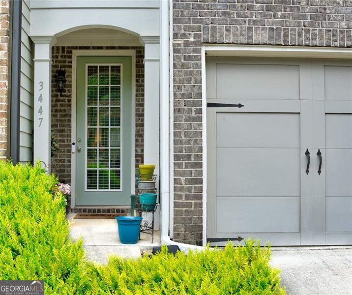 Stylish Townhome in Gated Community! Welcome to this beautifully designed 3-bed, 2.5-bath townhome in a quiet, gated community just off Hwy 78. The open floor plan features gleaming hardwood floors, high ceilings, and a chef's kitchen with granite countertops, a spacious island, and ample cabinet space. Upstairs, the primary suite offers a walk-in closet, double vanities, a garden tub, and an oversized shower. Two additional bedrooms provide plenty of space and privacy. Step outside to enjoy a private patio and a rare, oversized backyard-perfect for entertaining or relaxing. Conveniently located near top-rated schools, shopping, and dining, this home offers the perfect blend of comfort, style, and accessibility. Don't miss out!