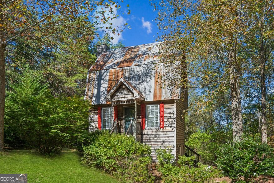 Nestled in a peaceful mountain setting, this charming country home offers warmth, character, and stunning natural surroundings. With two cozy bedrooms on the second floor and a bright loft on the third, this inviting getaway is perfect for anyone seeking comfort and quiet in the mountains.    The main level welcomes you with a living area featuring rustic wood accents, a stone fireplace, and plenty of natural light. A well-designed kitchen provides everything you need for everyday living or weekend entertaining.    Upstairs, two snug bedrooms offer a restful retreat after a day of outdoor adventure. The third-floor loft adds a unique touch - ideal as a reading nook, office, art studio, or additional sleeping space with incredible mountain views.    Step outside to a covered back porch where you can enjoy crisp morning air, listen to the sounds of nature, or relax under a star-filled night sky. Whether you're looking for a full-time residence, weekend escape, or income-producing vacation home, this cozy mountain retreat has it all.