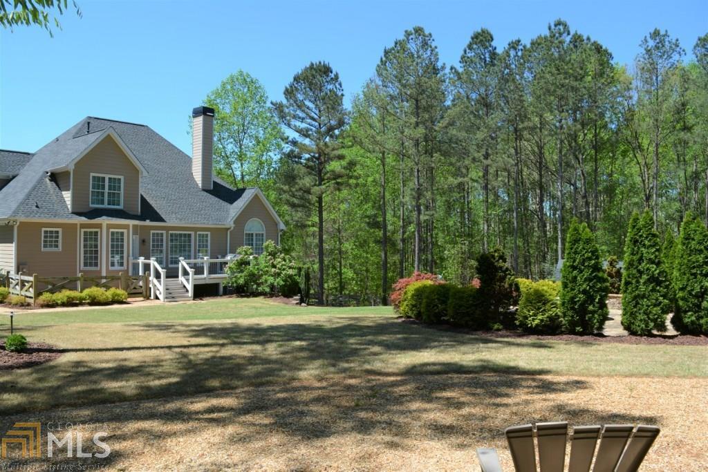 You will not believe the comfort and quality here! Exquisite master-on-main floorplan set on a beautifully landscaped 1.14 acre lot. Gorgeous decorator touches and lots of upgrades and creature comforts: recessed lighting, built-in speakers, landscape lighting and irrigation, back-up generator, automated lighting system, new roof & more. Great master suite with sitting area and whirlpool bath. Amazing terrace level w/bar and game room, classy home theatre, exercise room & full bath. Huge fenced backyard with fire pit, large shed and an amazing array of landscaping. This is a real stand-out and you will feel right at home here. I promise!