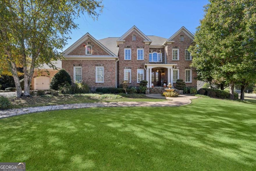 Welcome to 2071 Trimelston Drive, an elegant and newly refreshed estate nestled in the prestigious, gated Georgia Club community. This stunning home combines timeless architecture with modern updates, offering the ultimate in comfort, style, and resort-like amenities.    Step inside to discover a beautifully refined interior, featuring hardwood floors, fresh paint throughout, and updated designer touches, including new lighting, chic wallpaper accents, and newly renovated secondary bathrooms. The main level offers a spacious bedroom, perfect for guests.    The heart of the home opens to a bright new sunroom and an expansive deck overlooking the private backyard oasis. Outside, you'll find a saltwater gunite pool and spa, surrounded by a fully fenced yard with elegant wrought iron fencing-ideal for entertaining or quiet relaxation. This home sits at the end of the cul-de-sac and backs up to green space with the golf course beyond that, creating even more privacy.    The terrace level has been completely enhanced with a new office and flex room to complement the existing bar, theater room, recreation area, gym, and a covered porch for seamless indoor-outdoor living. With a four-car garage, this home provides both space and sophistication.    Experience refined living in one of Northeast Georgia's most sought-after communities-where golf, tennis, and club amenities meet luxury home design.