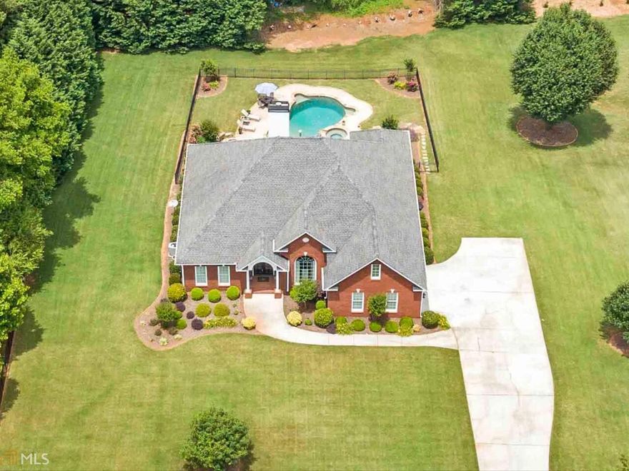 ABSOLUTELY STUNNING 4 SIDES BRICK RANCH ON FULL FINISHED BASEMENT *1.3 ACRE ESTATE SIZED LOT *GATED DRIVEWAY *PRIVATE IN-GROUND POOL WITH WATERFALL SPA *NEW WATER HEATER (2019) *HARDWOOD FLOORS THROUGHOUT MAIN *FORMAL DINING ROOM WITH BUTLER'S PANTRY *COFFERED CEILING IN THE FIRESIDE FAMILY ROOM *GOURMET KITCHEN WITH BREAKFAST BAR, STAINLESS STEEL APPLIANCES, GRANITE COUNTERS, TILED BACKSPLASH, ISLAND AND BREAKFAST ROOM *TRAY CEILING IN THE LUXURY OWNER'S SUITE *GORGEOUS MASTER BATHROOM WITH HIS/HER VANITIES, SOAKING TUB AND TILED SHOWER WITH FRAMELESS SHOWER ENCLOSURE *2 SECONDARY BEDROOMS SHARE JACK AND JILL BATHROOM *4TH BEDROOM / OFFICE ON MAIN  *FINISHED TERRACE LEVEL WITH MOVIE ROOM, 2 HUGE GAME ROOMS, EXERCISE ROOM, POTENTIAL 5TH BEDROOM AND FULL BATHROOM *AMAZING OUTDOOR ENTERTAINING SPACE ON THE COVERED DECK, COVERED PATIO OR AROUND THE POOL WITH FIRE PIT AREA *NO HOA