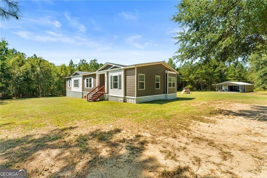 Photo of 4179 Nevils Groveland Road, Pembroke, GA 31321 (MLS # 10853312)