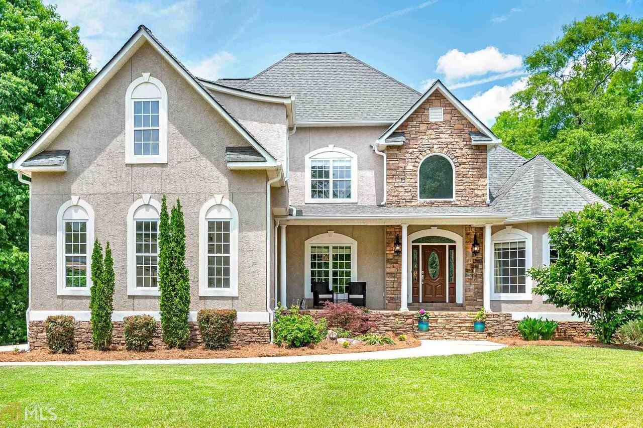 Immaculate Executive Estate on 9+acres with gorgeous park-like setting overlooking fabulous salt water pool! Vacation at home with this extremely well maintained custom home complete with full finished terrace level offering a full second kitchen....perfect for in-law or multi-generational living. The soaring two story foyers welcomes you into the oversized Grand Room w/fireplace, Dining Room, Chef's Kitchen with ice machine opens to cozy Keeping Room w/stacked stone fireplace, and massive Owner's Suite w/sitting/living area all on main floor. Upgrade and detailed finishes, extensive trim-work, hardwoods, high ceilings, en-suite secondary bedrooms, and so much more! Terrace level also has large bedroom, full bath, billiard room (would make great home office), exercise/flex room and family room with a 3rd fireplace and workshop with boat door. 3 car garage with parking pad, unfinished bonus area, tons of storage...and a peaceful spot to sit and enjoy Tussahaw Creek across the rear of the property. You don't want to miss this one! Shown by appt only.