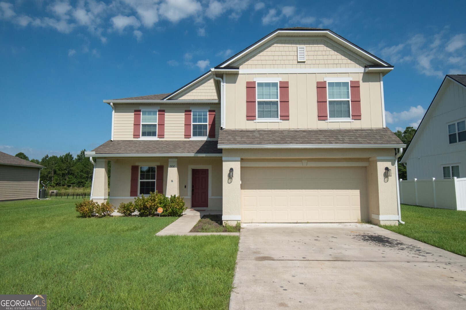 If you're looking for space, style, and a beautiful view, this home checks all the boxes. With over 3,000 square feet, 5 bedrooms, and 3 full bathrooms, there's room for everyone to spread out and enjoy. The kitchen is a dream for anyone who loves to cook or entertain, featuring stainless steel appliances, a double oven, solid surface countertops, and a big island with a bar sink. There's even a custom built-in bookcase in the foyer that adds a special touch right when you walk in. The primary bedroom has a gorgeous trey ceiling and leads into a spa-like bathroom with a separate shower, soaking tub, double vanity, and a huge walk-in closet. Tile flooring throughout the main floor and bathrooms makes cleanup easy, while cozy carpet keeps the upstairs and bedrooms comfortable. One of the best features is the screened porch stretches the full length of the house, perfect for relaxing or entertaining while enjoying peaceful lake views out back. This home has it all: space, style, and a great location. Come take a look. You won't want to leave!