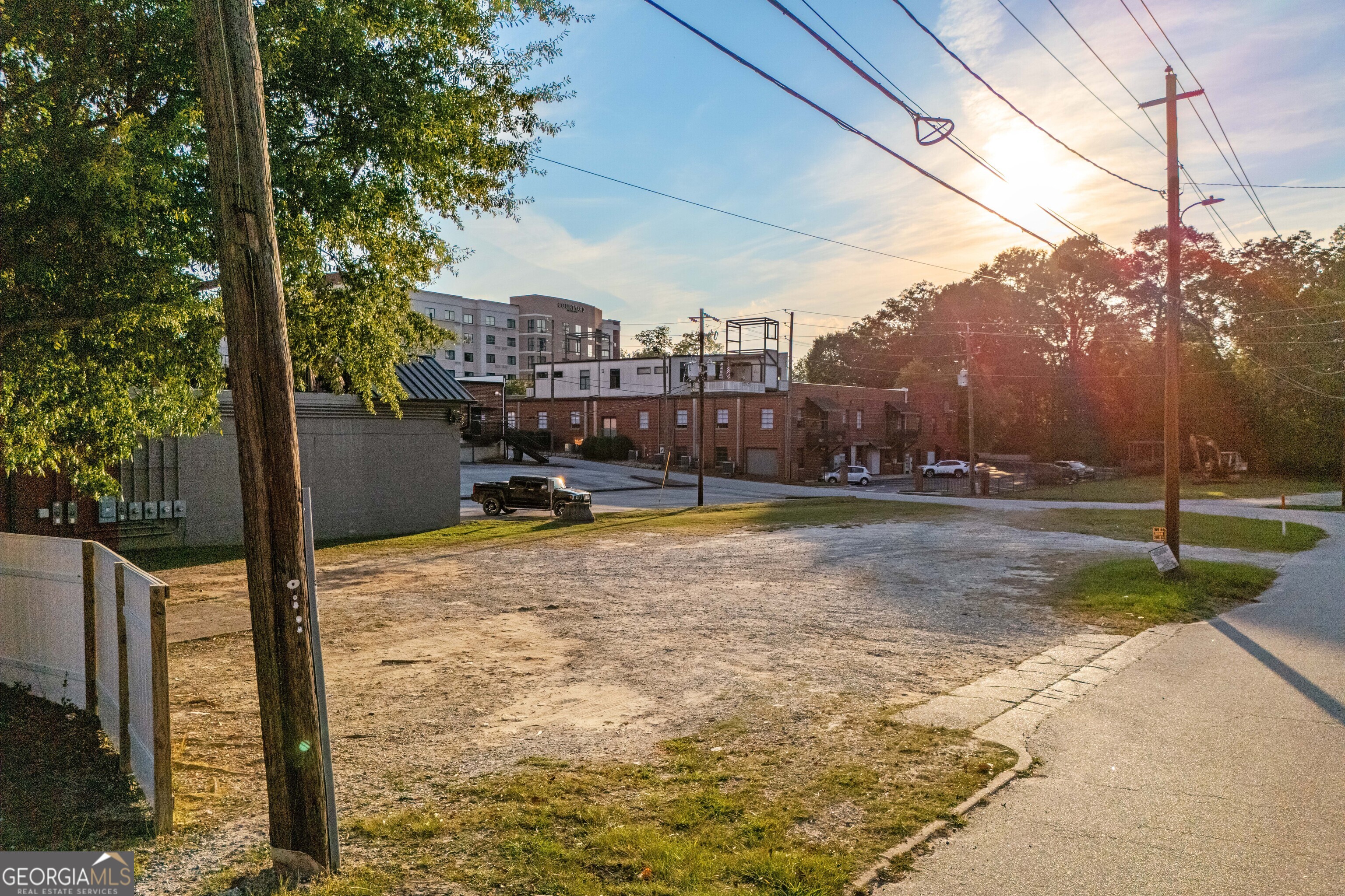 Prime Downtown Commercial Lot - .33 Acres This corner lot, on Ward Street is located at right off of Rome Street in the highly sought-after downtown Carrollton area, offers endless possibilities for development. The level lot is perfect for a new commercial build or can serve as much-needed additional parking space for the bustling downtown district. This lot is walking distance from the square and conveniently located near the lofts and the Marriott. With all utilities readily available, this clean slate is ready to accommodate your vision. Don't miss this rare opportunity to invest in one of Carrollton's most desirable locations. Ideal for retail, office space, or mixed-use development!