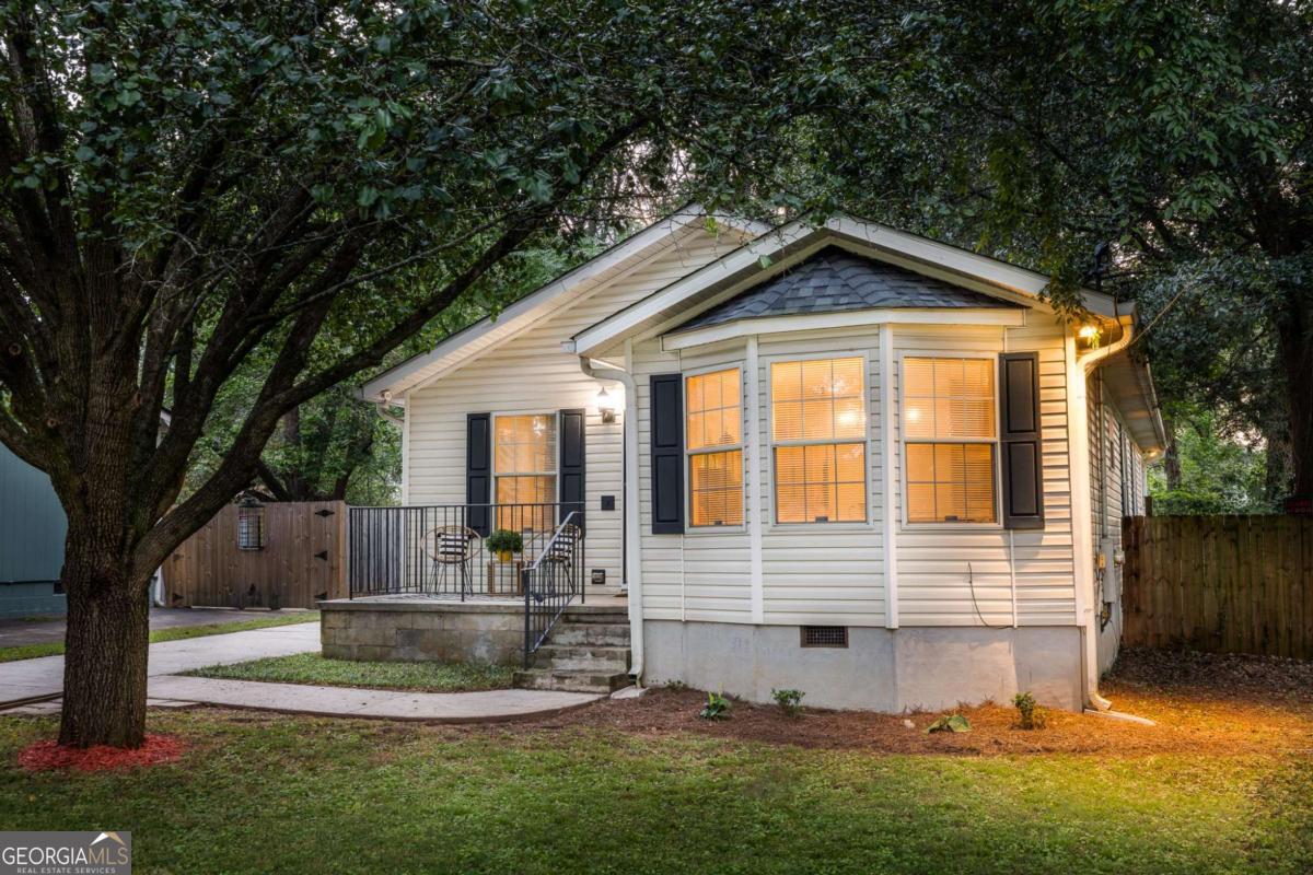 Welcome to this impeccably well-maintained cottage, just a mile from the East Atlanta Village! This move-in ready gem offers a smart, single-level layout with three bedrooms, two full baths, a separate dining room, and a cozy living space anchored by a wood-burning fireplace. The kitchen is ideally positioned with views of the living room and easy access to the dining area-perfect for family dinners or hosting your pals. Down the hall, you'll find a laundry room, two guest bedrooms, and a full bath. Tucked at the end is a spacious primary suite featuring a walk-in closet, French doors that open to the back deck, and an ensuite bath with double vanity, soaking tub, and separate shower. Whether you're an owner-occupant looking to make a few personal touches or an investor eyeing a property with solid rental history, this home is full of opportunity. Recent updates include a newer roof (approx. 4 years), newer water heater (approx. 3 years), and updated plumbing and electrical systems. Zoned for Burgess-Peterson Elementary and set on a generous lot, this one checks all the boxes!
