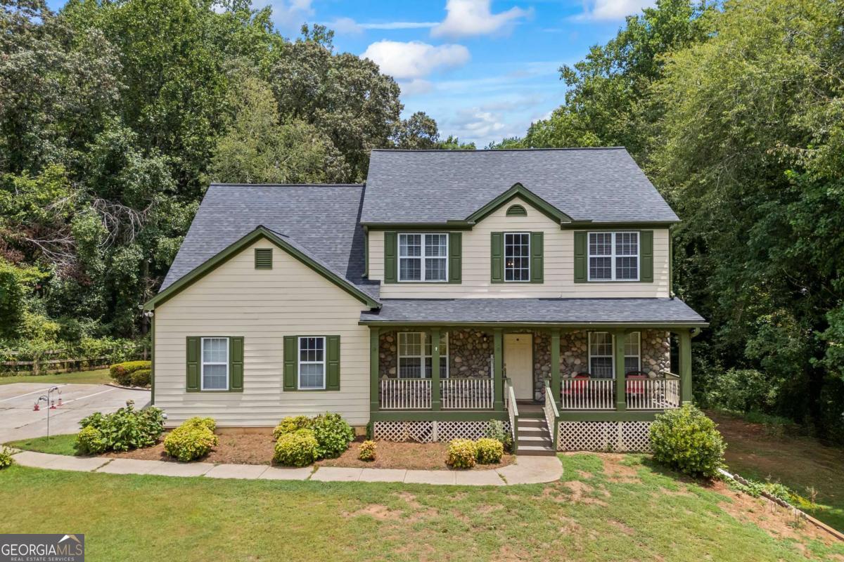 Discover this stunning, move-in-ready home in the highly desirable Timberline at Lake Lanier community. Nestled on over an acre, this 5-bedroom, 3-bath residence offers the perfect blend of comfort, privacy, and convenience. Freshly painted throughout, the main level includes a guest bedroom and full bath, along with a warm and inviting family room featuring a cozy rock fireplace. The kitchen is equipped with granite countertops, a tile backsplash, white cabinetry, and a breakfast bar with an open view to the family room, ideal for both everyday living and entertaining. Upstairs, the oversized Master suite impresses with a tray ceiling, walk-in closet, and spa-like bath with dual vanities and a jetted tub. Generously sized secondary bedrooms offer plenty of space and storage. A full basement below the main level provides additional room for future expansion or recreation. Additional highlights include a side-entry garage, a nearly new roof, and a newer water heater. The community features large lots and fantastic amenities such as a Junior Olympic-sized pool, pickleball courts, a playground, and more. Conveniently located near top-rated Forsyth County schools, just minutes from Lake Lanier, shopping, dining, and entertainment. Don't miss this opportunity! Schedule your showing today!