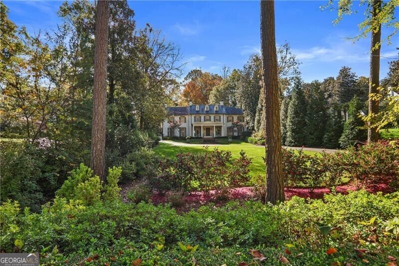 Welcome to this stunning James Means designed home on one of Buckhead's most sought after streets. This 5-bedroom, 6-bath, and 2-half-bath home offers an exceptional blend of comfort, style, and privacy. As you step inside, you'll be greeted by gleaming hardwood floors throughout, creating a warm and inviting atmosphere in every room. The spacious layout is perfect for both family living and entertaining, with plenty of room for everyone. Enjoy the best of outdoor living with a beautifully landscaped yard that provides the ideal setting for relaxation and recreation. The outdoor playground is a dream for children while the surrounding greenery ensures a sense of tranquility and privacy. Whether you're hosting gatherings, enjoying quiet evenings, or watching the kids play, this home offers it all. With its spacious bedrooms, ample bathrooms, and a fantastic location that blends both seclusion and convenience, this property is a true retreat. Don't miss your chance to make this incredible home yours!