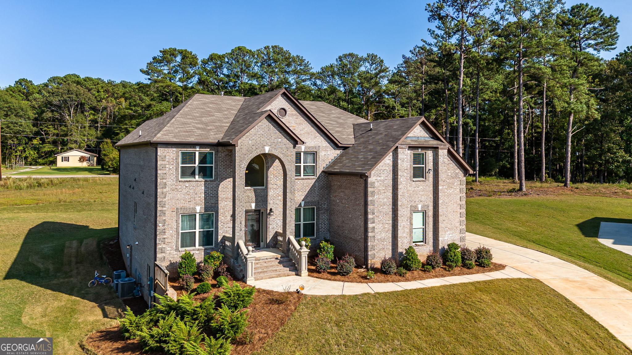 Magnificent 5-Bedroom, 5.5-Bathroom Home in One of McDonough's Most Prestigious Communities. Nestled in the heart of McDonough's most sought-after community, this stunning 5-bedroom, 5.5-bath home offers a rare combination of elegance, luxury, and functionality, perfect for those who seek the finer things in life. With top-tier schools just moments away, this home is ideal for families desiring convenience alongside superior living standards. As you step through the Grand Entryway, you'll be greeted by soaring ceilings, stunning architectural details, and a sense of grandeur that sets the tone for the entire home. From the gleaming hardwood floors to the crown molding and custom finishes, every inch of this house has been designed with luxury in mind. The Main Level has an open-concept living area which features large windows that flood the space with natural light, highlighting the sophisticated details and providing a seamless connection to the outdoors. The spacious gourmet kitchen is equipped with high-end stainless steel appliances, custom cabinetry, granite countertops, and a large island, perfect for entertaining and family gatherings. A formal dining room, just steps away from the kitchen, is ideal for hosting dinner parties and holiday meals. The inviting family room centers around a beautiful fireplace, offering a cozy yet elegant space for relaxation. Each of the five generously sized bedrooms is a private retreat, boasting en-suite bathrooms for ultimate convenience and privacy. The luxurious primary suite is a sanctuary of its own, complete with a spa-like bathroom featuring dual vanities, a soaking tub, a separate glass-enclosed shower, and an expansive walk-in closet. The additional bedrooms are equally spacious and well-appointed, with ample storage and large windows. What truly sets this home apart is its 85% finished basement, which comes with a Henry County-approved permit-a rare find! This space offers endless possibilities: whether it becomes an in-law suite with its own private entrance, an entertainment area, or additional living quarters, the options are limitless. The high-quality construction materials used ensure durability and longevity, further enhancing the value of the home. As a bonus, the home is equipped with a Puronics water filtration system, ensuring clean and safe water throughout the entire house-a feature that adds both peace of mind and modern convenience. Professionally landscaped yard with room to enjoy outdoor activities, BBQs, and family gatherings. The three car garage and additional parking space provide plenty of room for vehicles and storage. This property is very well maintained, making it move-in ready for its next owner. Don't miss the opportunity to live in this beautiful home, where luxury meets practicality, in one of the most prestigious neighborhoods in McDonough. With its ideal location near top-rated schools, spacious living areas, and versatile finished basement, this home is a true gem. Schedule a private tour today!
