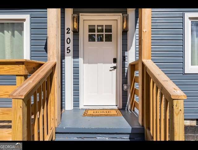 Hapeville cottage that has been boldy renovated! None of your run-of-the-mill upgrades, this timeless aesthetic will LAST! Neutral base with pops of color. Entry has a stained porch the size of a small deck with trellis underneath. Entry draws you in with the open floor plan. Family room is anchored by the wood accented wall and modern ceiling fan. Kitchen boasts quartz counter tops, white shaker cabinets with brushed gold hardware, stainless appliances and mounted range hood. LED lightin and pendants over the island doubles as a breakfast area with additional cabinet storage. Bedrooms are larger than expected at this square footage and the bathroom has a marble-tiled shower modern fixtures and ebony hardware. Top it all off with a privacy fenced backyard. **DO NOT DISTURB THE TENANTS**