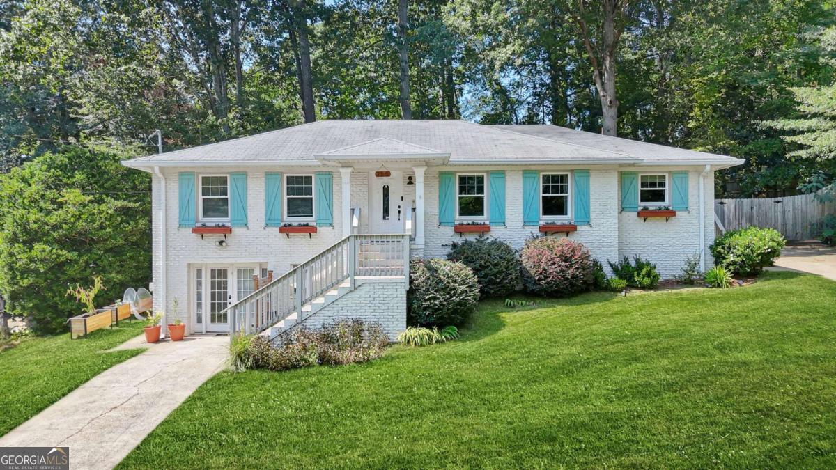 Welcome to this beautifully updated Smyrna home on a quiet cul-de-sac. The main level offers 3 bedrooms and an upgraded kitchen, while the expansive finished basement features an additional bedroom that doubles as another primary bedroom, a bonus room, laundry, and a home theatre. Enjoy 3 entry points, 2 separate driveways, a deck, fenced yard, and serene outdoor seating under the front porch. Walking distance from Campbell High and Smyrna Market Village, with The Battery, I-75, and I- 285 just minutes away.