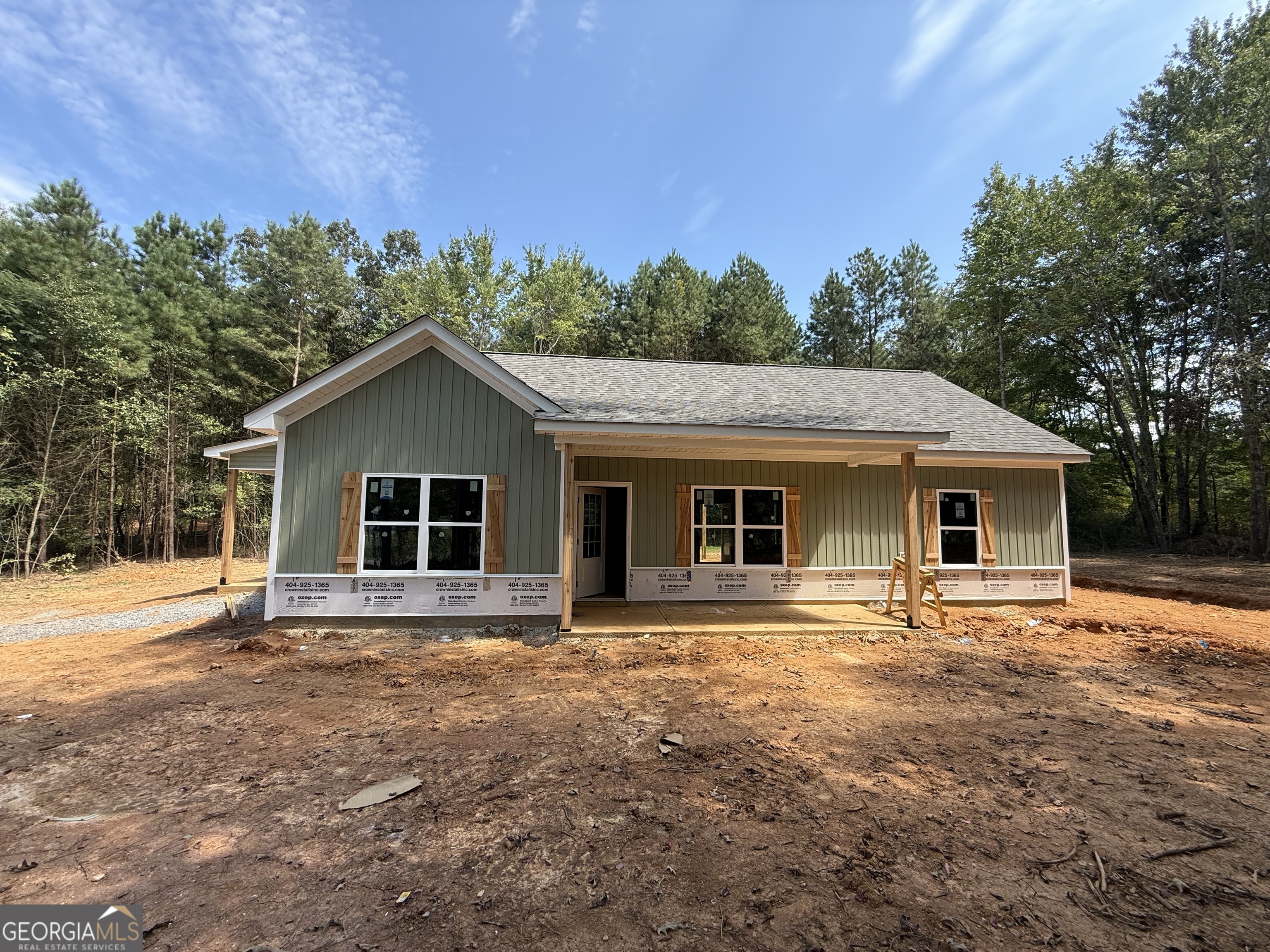 NEW CONSTRUCTION RANCH ON 3 QUIET ACRES - NO SUBDIVISION OR HOA!!! Act now for a FREE appraisal and $3,000 in incentives with our preferred lender. Conditions apply. See listing agent for details. This stepless ranch home is under construction on a serene 3.098-acre lot -- offering the perfect blend of privacy and convenience. Conveniently located north of Buchanan off of Hwy 27 going towards Cedartown. Featuring 3 bedrooms and 2 full bathrooms, the home showcases an open layout with vaulted ceilings in the main living and dining areas for a spacious, airy feel. There's still time for buyers to add their own personal touches! Contact the listing agent today! The kitchen is designed with granite countertops, a counter-height bar, and a stainless steel appliance package including an electric range, built-in microwave, and dishwasher. The split-bedroom layout provides privacy, and the primary suite features a walk-in closet and a bathroom with double vanities, framed mirrors, granite countertops, and a stand-up shower. The two secondary bedrooms are generously sized and share a full bathroom with a granite vanity and a tub/shower combo. Ceiling fans are included in the living room and primary bedroom. Outside, the home will be finished in low-maintenance vinyl siding with a stone water table for added curb appeal. This floor plan includes an attached carport. Don't miss this opportunity to customize your dream home in a peaceful country setting! ***Photos are of a home similar to the one being constructed, not of the actual subject property.***Construction is underway!***