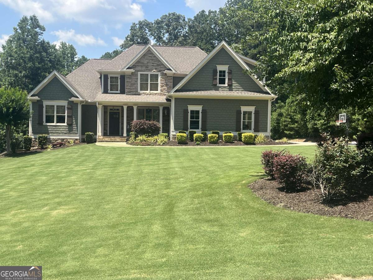 Distinguished gem! Country estate on three private acres with full terrace-level in-law suit, gated community in Creekview school district! If you need to house additional family, this is it! Terrace level has full in-law suite w living area, fireplace, bedroom, full bath, full kitchen, washer/dryer hookup and private patio area. House thoughtfully built for numerous people with two water heaters and 3 HVAC units. Everyone has hot water! Every level controls their temperature! And look at this! Terrace level has additional ample storage/extra expansion space. Main level has hard woods throughout with elegant stone fireplace. Wide kitchen with abundant storage space, eating area and eat-in island. Primary bedroom has generous amount of space and awaiting your decorating touches. You just have to see this primary bath! His/her sinks, soaking tub, separate shower and large walk in closet. Upstairs also has enormous multipurpose bonus room over garage. Hidden storage areas throughout home. Large screened porch and patio for perfect entertaining day to night. Deck spills into beautiful backyard surrounded by privacy trees. Pool in your future? You're set there too! Septic tank strategically placed on side of back yard with plumbing added to accommodate future pool. Nature trail on property right beside stream! Freshly painted interior. 5 minutes from shopping, restaurants and hospital. This quality rare so get here quick!