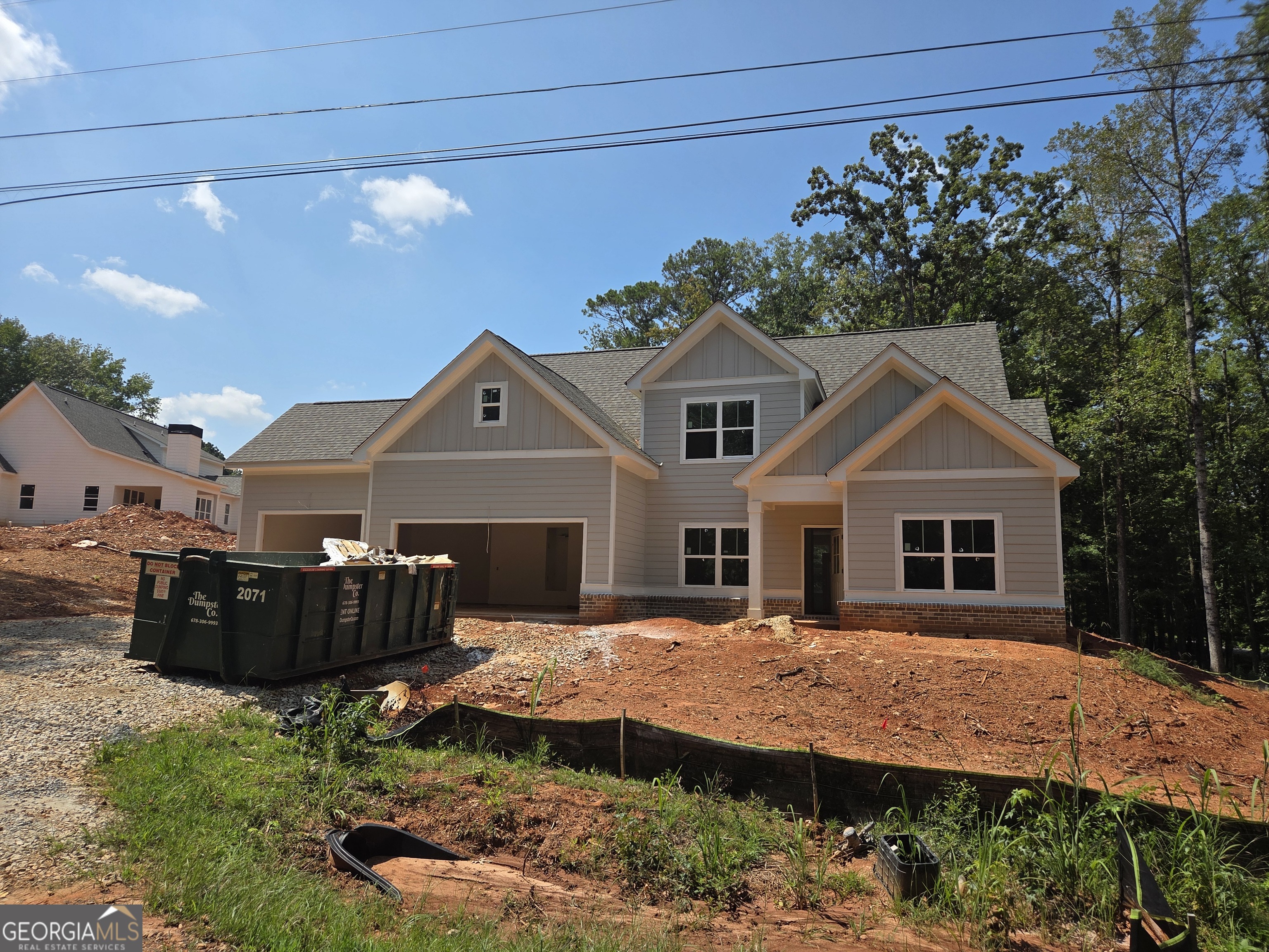 Location, Location, Location!! New Construction from Green Park Homes. This 4 bedroom 3 bath Cottage with bonus room is located in the heart of Lake Oconee. Located in Martin Oaks community which is very close to Harmony Crossing and the future Publix. The home boasts a great 3 car garage with 14x26 bay for boat storage and outdoor covered porch with a fireplace! The open floor plan features a chefs kitchen with SS appliances, Island, owners suite and guest bedroom. Vaulted ceilings in the family room, Luxury vinyl plank floors and linear electric FP, this all on the main level. Upstairs you will be able to enjoy a large flex room/media room along with 2 additional bedrooms and a full bath.