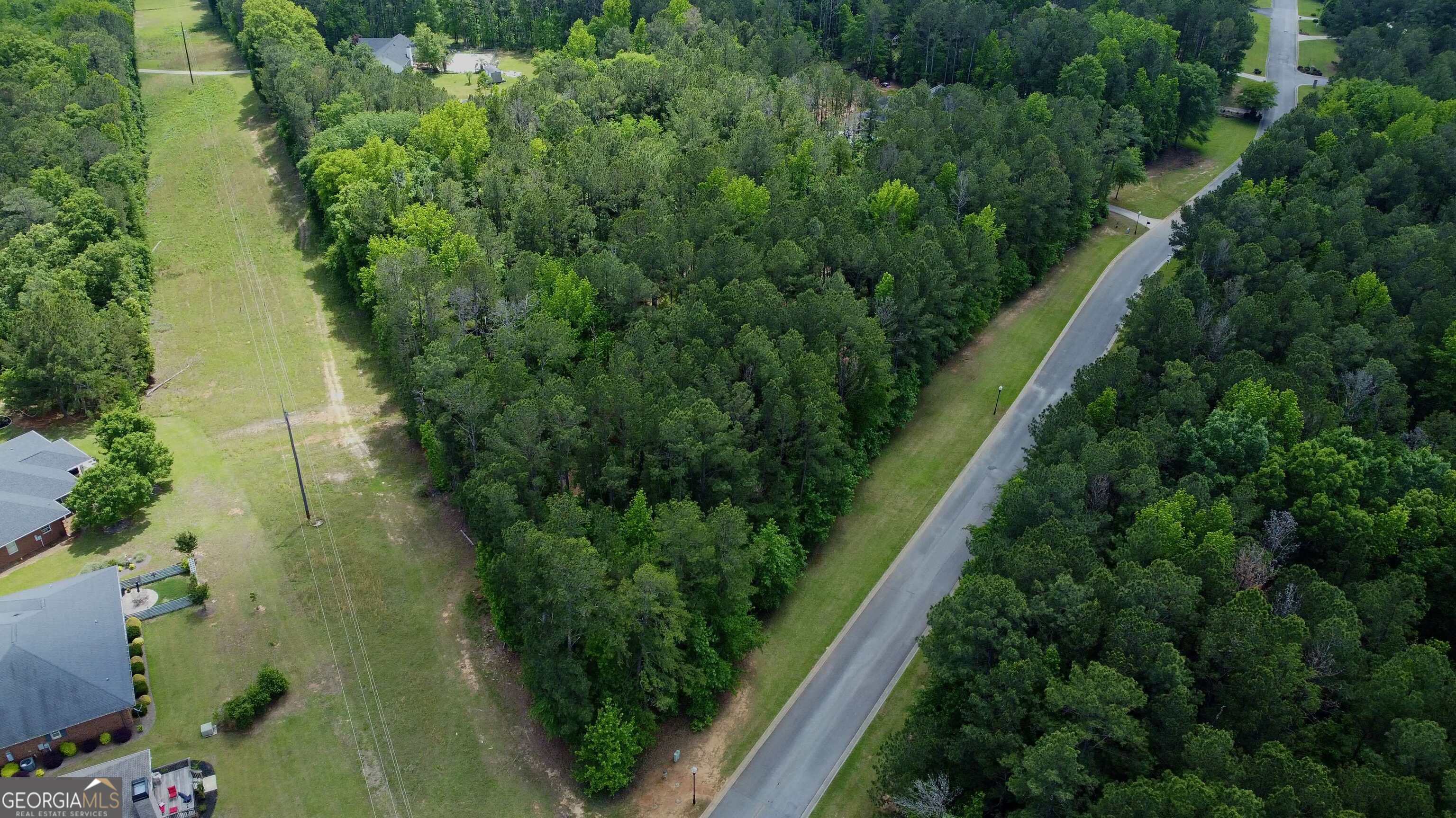 Welcome to your canvas of possibilities! Nestled within a premier gated community in Milledgeville, this expansive 4-acre vacant plot presents a golden opportunity to build your dream home-or homes-with privacy and exclusivity. Envision crafting a sanctuary where multiple homesites harmoniously blend with the serene beauty of well-maintained surroundings. This plot isn't just about ample space; it's about a lifestyle. Future residents will enjoy access to community amenities that make every day seem like a vacation. Take a dip in the pool, rally some friends for a match at the tennis court, let the kids loose on the playground, or plan a gathering at the clubhouse. Does it sound like a resort? Well, it's your new home! Your furry friends will love it too, as this pet-friendly community embraces all members of your family. Safety and walkability are top priorities here, ensuring peace of mind while you stroll through the clean and beautiful environment. You won't have to travel far for essentials or education, as the plot is conveniently located near top-tier schools like John Milledge Academy and several colleges, not to mention the Publix Super Market for all your grocery needs. Huley Park is just a stone's throw away, offering ample green space for a jog or a leisurely day out. Who says you can't have it all? Here at this prestigious location, combine the joys of pastoral living with the conveniences of city amenities. Build your future as you see fit-build it here.
