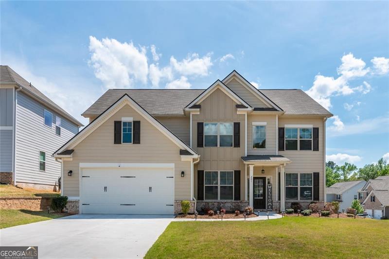 COMING SOON!! Hurry and check out this Gorgeous New Listing in the desirable Oakleigh Pointe Subdivision in Dallas, GA! This beautiful corner lot features 5 bedrooms, 4 full baths almost 4,000 sq ft. The kitchen is an HGTV gourmet style with 42 in cabinets, granite countertops, double ovens, tile backsplash, a large island, breakfast area, stainless steel appliances, and hardwood floors! Large family room with a gas fireplace, bed/bath on the main, 2 story foyer with hardwood floors, formal dining room, formal living room, iron spindles, 2 car garage, fenced in yard, covered screened in extended patio with a wood burning stone fireplace perfect for game day and entertaining. Upstairs you will find a long hallway, luxurious large owner's suite with a sitting room, trey ceilings, his & her double sinks, spa like bathroom with a tiled shower & tub, and a huge walk-in closet, additional large size bedrooms and full bathrooms. Amenities include a community courtyard that provides access to a clubhouse fully furnished with a full kitchen for reservations, swimming pool with a water slide, a playground, a gym, dog park, sidewalks, streetlights and tennis courts! The community is conveniently located to schools, food, grocery stores, and more. *Professionally manicured and treated lawn. *2-10 Home Warranty included! Schedule your showing today because this home will not last long on the market!