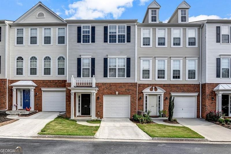 AMAZING VALUE! NEW ROOF JUST INSTALLED! Location and Convenience: This stunning townhome offers an ideal setting with easy access to GA-400, Windward Parkway, Avalon, Halcyon, and downtown Alpharetta. The thoughtfully designed layout features a versatile guest bedroom or office on the lower level with a half bath. A full-size laundry room is also on the lower level. Upstairs, you'll find an inviting open-concept kitchen with an eat-in dining area and stainless appliances. Kitchen cabinets have just been repainted as well as the kitchen walls. The home has a large Great room space with a cozy fireplace and a half bath. There is a private deck that overlooks serene wooded surroundings. There is a small yard that is flat that can be fenced in. The upper level hosts three additional bedrooms, including a spacious owner's suite complete with a walk-in closet, as well as two roomy secondary bedrooms and a full bath. Enjoy the beautiful private lake with walking trails,community pool and club house. The HOA covers water, trash, sewer, and upkeep of the community grounds. Situated at the back of the neighborhood on a quiet cul-de-sac, this beautiful townhome is move in ready! It is located in the highly-rated Manning Oaks Elem,Hopewell Middle and Alpharetta High School District. Home is close to shopping and restaurants. Don't miss out on this fantastic opportunity!