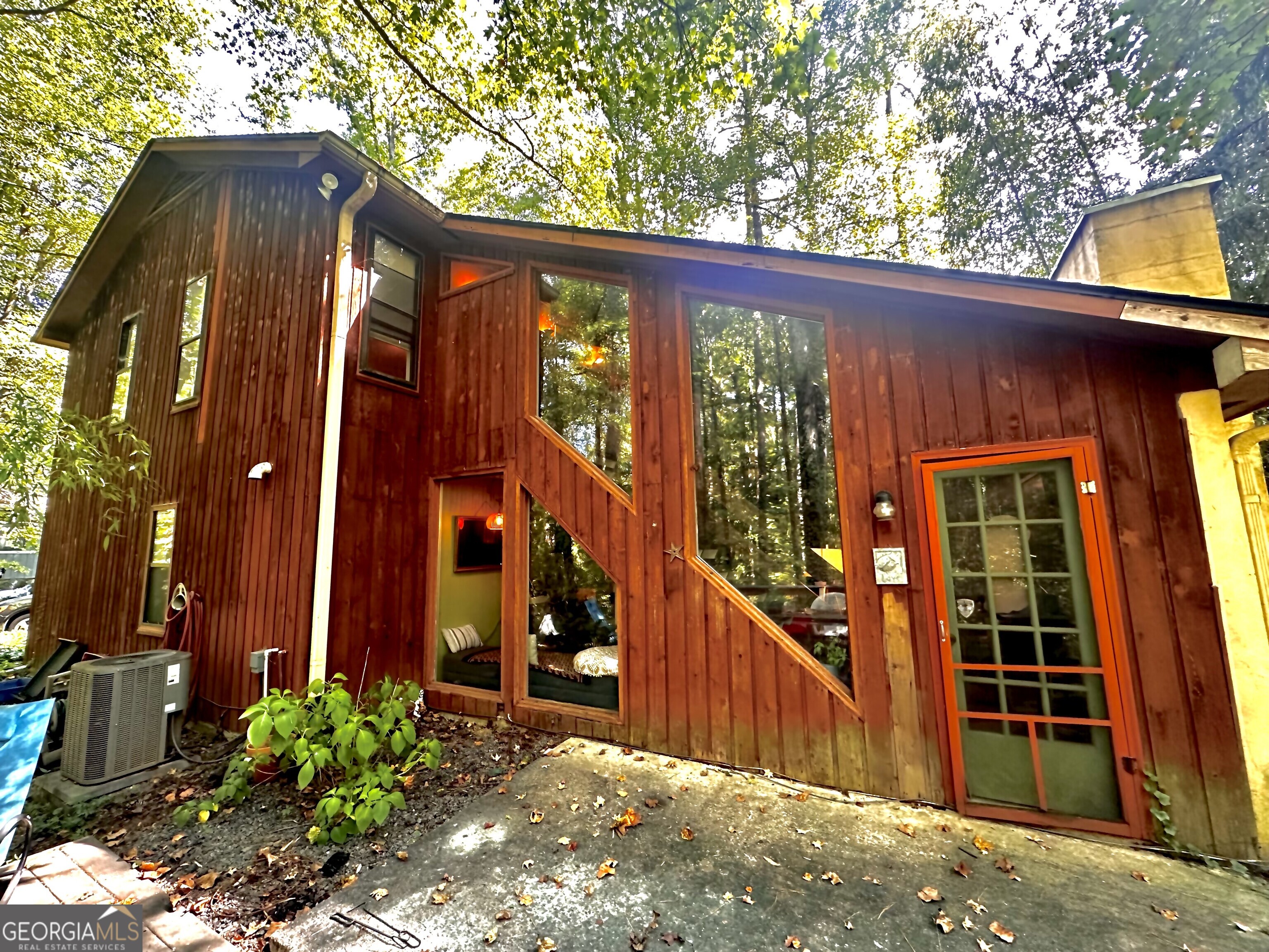 ustic Charmer with Big Potential in East Cobb ? Bring your vision and unlock the equity in this 3 bed / 2.5 bath, 1,424 sq ft gem in one of Cobb County's top-tier school districts. The heart of the home is the living room, boasting dramatic vaulted natural wood ceilings with exposed beams, soaring geometric windows, and a cozy wood-burning fireplace with gas starter, deck in backyard, and a stream that runs along the back of the house - pure rustic charm and character. The woodland backyard is a natural retreat for bird and nature lovers, while inside you'll find a great layout with all bedrooms upstairs and a flexible converted living space (with HVAC!) plus a single-car garage. Just needs cosmetic updates to shine! Whether you're an investor seeking upside or a homeowner ready to roll up your sleeves, this rustic beauty is packed with equity potential. Prime East Cobb location, Natural retreat setting, Excellent schools with the elementary school being the 4th best in the state Don't miss your chance to reimagine this charmer into something spectacular!