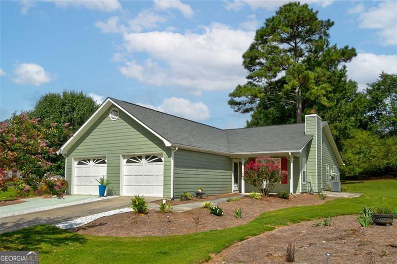 Nestled in the highly desirable *Lafayette Garden Homes*, a 55+ adult community, this beautifully updated *ranch-style duplex* offers a rare opportunity to own the *righthand side* of a thoughtfully maintained residence. Designed for ease and comfort, the *open-concept layout* features *vaulted ceilings* in the living room and a *gas log fireplace* that adds warmth and charm. The *renovated kitchen* gleams with a *complete set of appliances* (installed *October 2019*), complemented by *fresh interior paint* and *whole-house flooring upgrades*. Both *full bathrooms* have been stylishly refreshed, and the *roof was replaced in February 2020* with *architectural shingles* for added peace of mind. Recent enhancements include a *whole-house water softener* and *replacement of polybutylene pipes* in *2023*, along with *exterior painting completed in 2024*. The *attached garage* offers convenience, while the *large, level backyard* invites quiet mornings or relaxed evenings. Enjoy nature trails at The Ridge Preserve, concerts at City Center Park, and scenic views at Starr's Mill. Just minutes away, Trilith Experience offers dining, shopping, and creative events. This home also provides seamless access to McCurry Park, Southern Ground Amphitheater, Fayetteville Pavilion, and major routes including GA-85, I-75, and Hartsfield-Jackson Airport With its blend of thoughtful upgrades, prime location, and community features, this home is a rare find-and those who hesitate may miss out. Reach out to schedule a showing today! Sold As-Is and Move-in ready!
