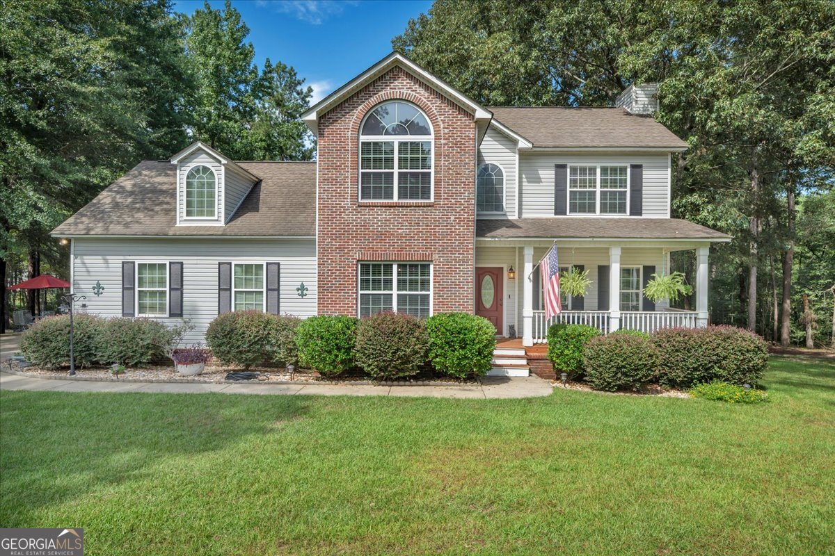 3054 Plantation Drive is a beautiful 4 bedroom, 2.5 bath home offering 2,550 sq. ft. of comfortable living space on a private lot in The Plantations at Evergreen! Built in 2007, this home features a striking combination of brick and vinyl siding for timeless curb appeal. Inside, you'll find a spacious layout designed for both everyday living and entertaining. The large master suite boasts an en suite bathroom with dual vanities, a soaking tub, separate shower, and a generous walk-in closet. Three additional bedrooms provide plenty of space for family, guests, or a home office. Enjoy the outdoors from your inviting front porch, large back deck, or the fenced-in backyard! This property is perfect for pets, play, and gatherings. Nestled in a quiet, private setting with mature trees, this home offers privacy and comfort. Don't miss your chance to make this beautiful property your forever home!
