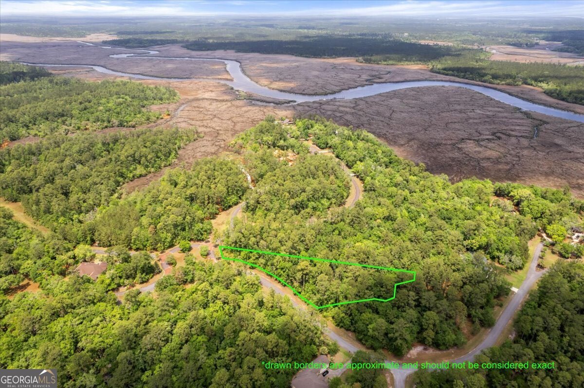 Here's your chance to build the home you've always wanted on a spacious 1.2-acre lot in the gated community of River Place Plantation in Waverly, Georgia. Surrounded by tall pines and coastal marsh, this homesite offers plenty of space and privacy, all within a quiet, well-maintained, gated neighborhood. River Place Plantation features thoughtful amenities, including a clubhouse, community pool, and a deep-water dock with access to the Little Satilla River-perfect for boating, fishing, or just enjoying life on the water. Whether you're looking to build a full-time residence or a weekend getaway, this lot gives you the flexibility to create something truly special. With easy access to I-95 and a short drive to Brunswick, St. Simons Island, and Jekyll Island, you'll enjoy the best of both peace and convenience. Come walk the property and see why River Place Plantation is one of coastal Georgia's best-kept secrets.
