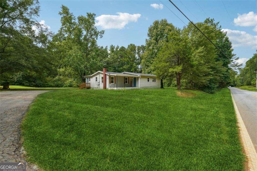 Photo of 309 Cowan Road SE, Conyers, GA 30094 (MLS # 10874594)