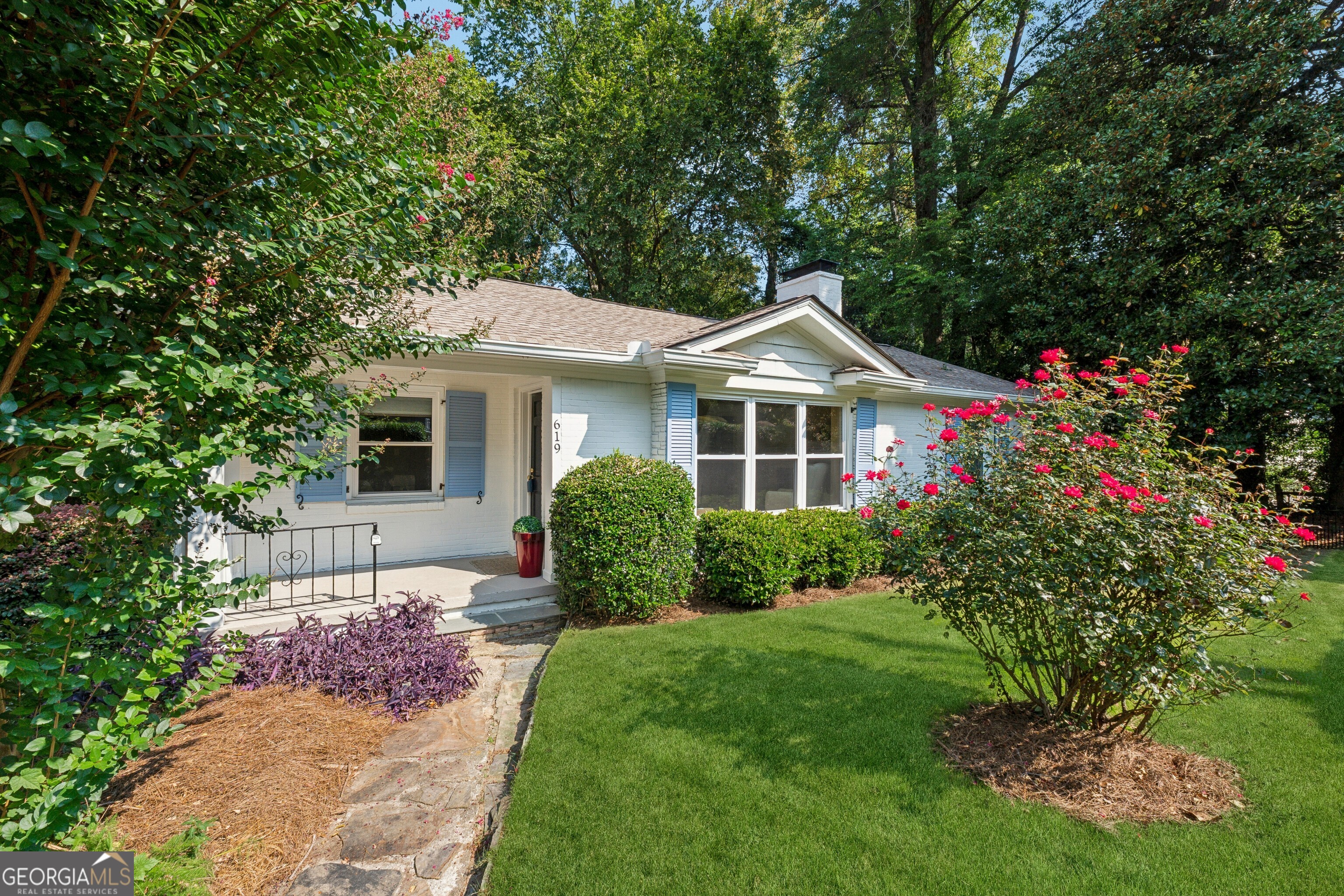 Welcome home to the heart of it all! This 4-bedroom/4-bath gem with a basement is surrounded by professional landscaping and nestled in a wonderful Buckhead community zoned for award-winning schools. Within minutes of the booming Westside, Midtown, Downtown, Atlantic Station, and I-75, you can live in the middle of Atlanta and walk to city parks, restaurants, and hotspots. Step inside to experience the well-designed floor plan which features 2 primary suites on the main level. The welcoming family room with a cozy brick fireplace has space for all your furniture. The updated kitchen has gorgeous Jenn-Air appliances and maximizes space for countertops and storage. Three of the bedrooms can fit king-size beds, and no bedrooms share walls, which is a rare privacy feature. The meticulous owner has made countless improvements in recent years to blend the original charm with modern upgrades -- newer energy efficient windows, architectural shingle roof, Trane HVAC, lighting, bathroom vanities/fixtures, hardwood floors, carpet, water heater, and more. Downstairs, the basement adds a world of space, with storage nooks and a fabulous entertainment lounge for hosting and family gatherings. Don't forget the oversized walk-in laundry room with areas for folding and sorting. Both levels have walk-out patios which overlook a grassy, level, fenced backyard and Channing Valley Park. Parking is easy in the 1-car garage with bonus space and the 2 pads in the new driveway. For outdoor enthusiasts, Bobby Jones Golf, Bitsy Grant Tennis, and the Northside Trail to the famous Atlanta Beltline are steps away. What an incredible value in this sought-after intown neighborhood. The long-time owner says that this has always been a happy home, and now it's time to make more joyous memories here.