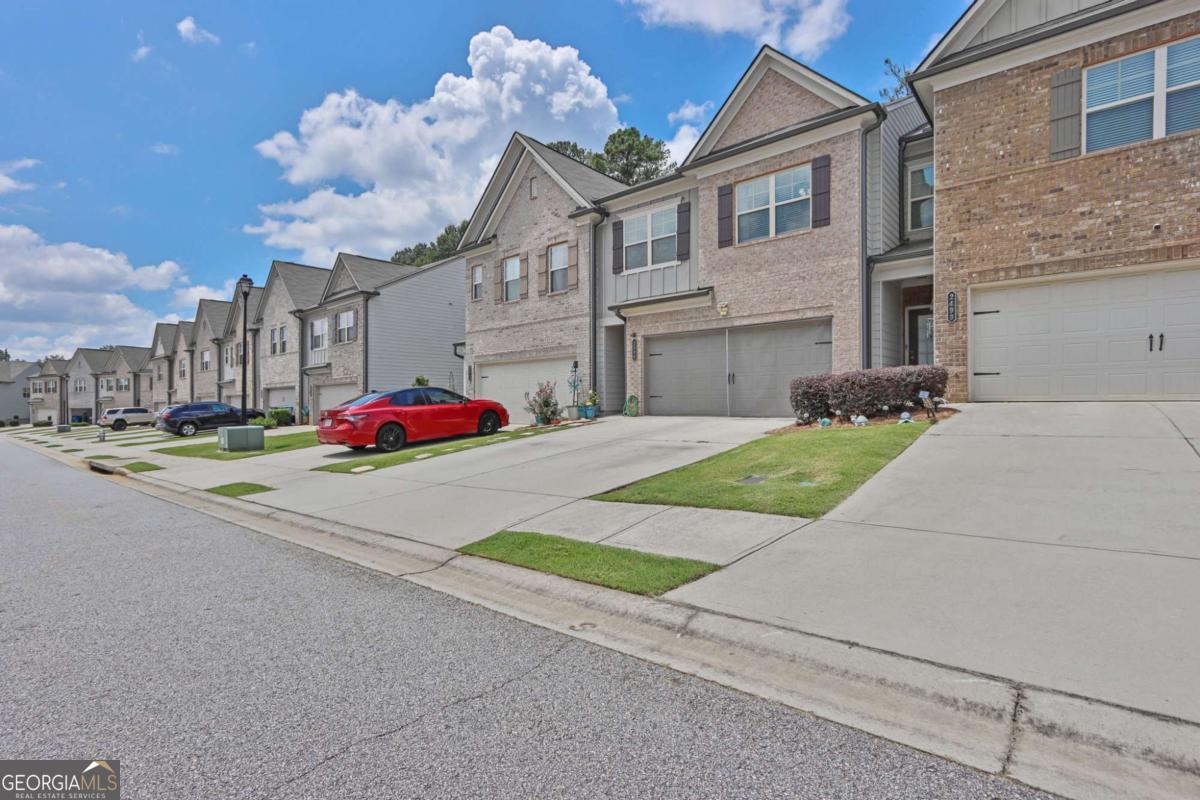 Welcome to 2509 Irwell Way - a modern two-story townhome in the desirable Manchester Place community Townhome with 3 Bedrooms, 2.5 Bath & 2 car private garage. Hardwoods throughout main floor. House was built in 2019 and is in immaculate condition ready for your family to enjoy. Featuring wide plank LVP flooring on the main level with Granite Countertops, SS appliances, and a kitchen island. The living room is oversized with tons of natural light. Owner's bath features shower only & walk-in closet. Each bedroom includes a walk in closet. Relax in your oversized owner's suite, complete with a walk-in closet and a spa-like bathroom. You'll love living in this pool community Enjoy the convenience of quick access to I-85, with shopping and dining just minutes away. Plus, with Northside Gwinnett Hospital around the corner, you'll have easy access to top rated healthcare. Blending comfort, style, and location, this townhome is a must-see. Schedule your tour today!