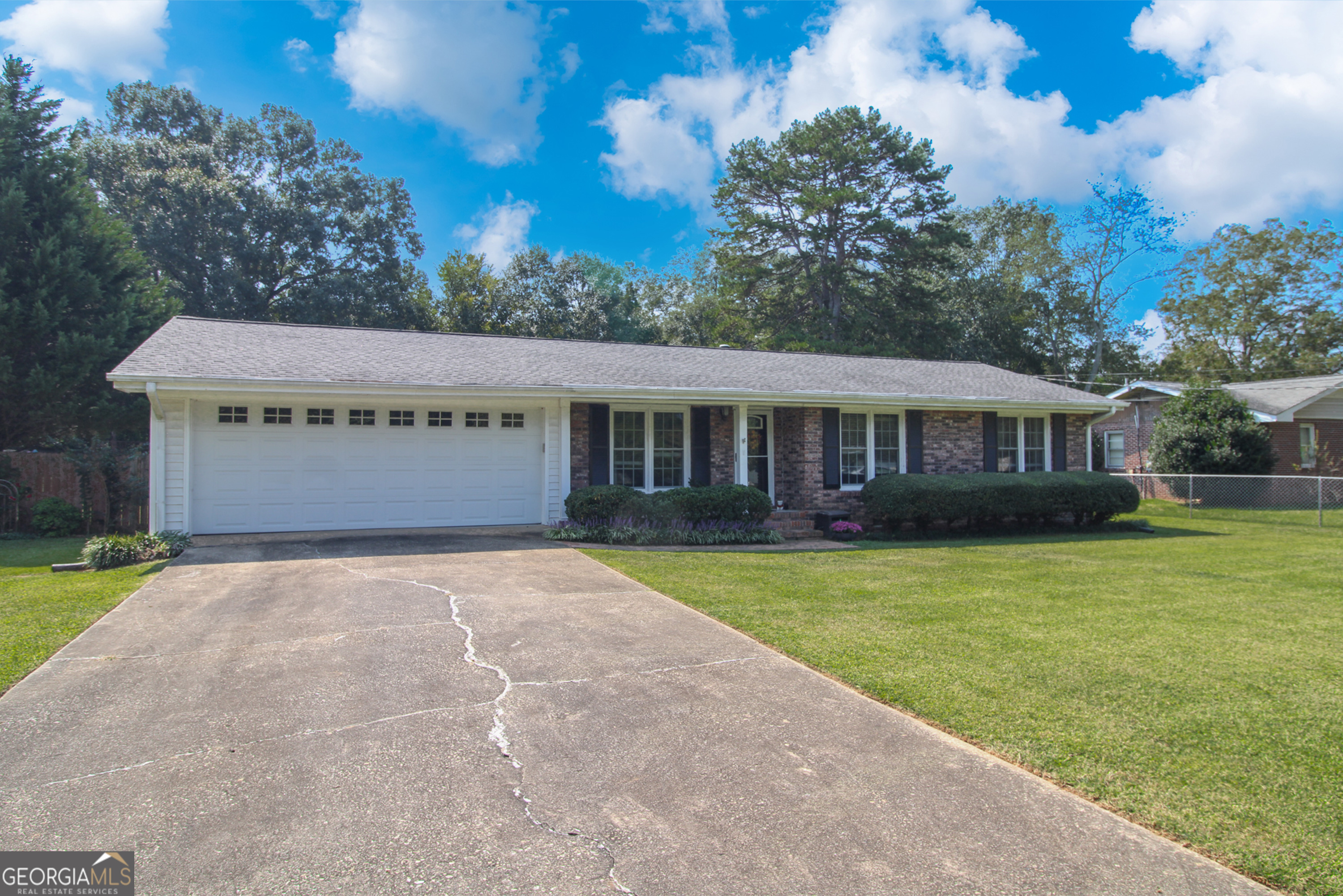 Welcome home to this cozy, well-maintained brick ranch with a fenced-in backyard. This lovely home has a large family room that leads to a spacious deck/patio with a spacious back yard complete with storage building. Interior features include hardwood floors, tile and exposed beams in the family room. Close to shopping, restaurants and parks. Easy access to Hwy 316 and 85.