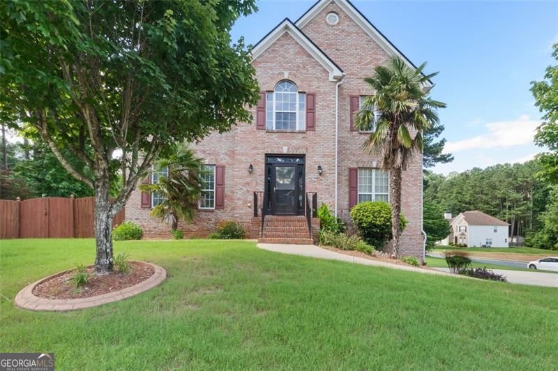Your tropical oasis awaits you! This beautifully renovated 4 Bed/4 Bath, 2-Story home in Powder Springs, sits on pristine landscape in a corner lot surrounded by beautiful palm trees with one of the communities' largest backyards. The entire home has newly refurbished hardwood floors, freshly painted walls, and a spacious floor plan perfect for you. Zoned for the highly coveted McEachern High School district, this home won't last long. Thoughtfully designed and manicured kitchen boasts quartz countertops, tile backsplash, a large breakfast bar, and modern stainless steel appliances. The master bedroom features a tray ceiling, private balcony to take in the fresh air and sun rays from one of the largest backyards in the community. Vaulted bathroom ceilings with porcelain tiles and quartz countertops makes even the bathroom a stunning destination within the home. Architectural 30 year roof installed 5 years ago. Finished basement with full bathroom to give you the feel of escape and change in scenery within your own home.