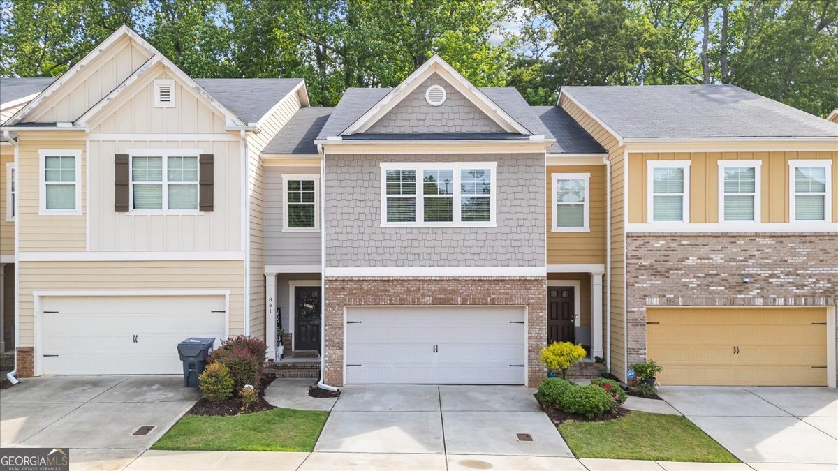 If convenience is what you're looking for, this Marietta townhome is exactly where you want to be-just minutes from Marietta Square, The Battery Atlanta/Truist Park, Kennesaw Mountain, and with easy access to I-75. This move-in ready home features fresh paint, new carpet, engineered hardwoods on the main level, and a fully finished basement with a bedroom and full bath-ideal for guests or a home office. The kitchen includes granite countertops, a walk-in pantry, and opens to the breakfast area and cozy family room with gas fireplace. Enjoy a private, level backyard with no rear neighbors. The owner's suite offers a sitting area and double vanity en suite, plus spacious secondary bedrooms with walk-in closets. HOA includes lawn maintenance.