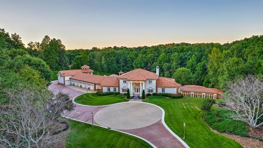 This RESORT STYLE Home is the Ultimate Entertaining Venue! Nearly 5 Secluded Acres complete with Pebble Tec Heated Salt-Water Pool, Spa, Tennis Court, 2 Volleyball Courts, 19 Hole Putting Green, Several Gazebos, Oversized Marble Balconies, Parking for at Least 100 Vehicles and State of the Art Outdoor Lighting Throughout the Property. This CUSTOM BUILT Estate is Ready to Host 1,000 Guests with 4 Full Chef's Kitchens, 2 Huge Wetbars and 2 Outdoor Kitchens. The BALLROOM Will Easily Accommodate Gatherings of 200+ with Full Wet Bar/Buffet, Stage Area for a Band or DJ, Billiard Room and His/Hers Bathrooms with Several Stalls and Shower. The THEATRE ROOM was Custom Designed and Recognized as One of the Top HOME THEATERS in the WORLD. The 7 Bay Garage Opens on Both Sides to Create Even More Entertaining Space. The SEPARATE APARTMENT with Full Kitchen, Bedroom, Full Bath, Laundry, Living Room & Balcony overlooking the Pool is the Perfect NANNY/IN-LAW SUITE. The Attention to Detail in this LUXURY Home is Unbelievable. GATED with SECURITY SYSTEM, Extensive Custom Millwork, ELEVATOR, Exquisite HIGH END FINISHES throughout! Easy Commute to Downtown Atlanta and Atlanta International Airport.