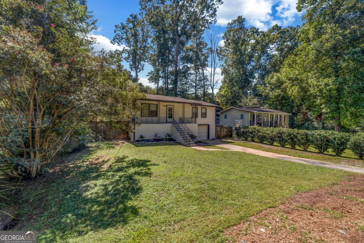 Completely remodeled home in the heart of Kennesaw! This beautiful property features modern updates throughout and a spacious layout perfect for today's lifestyle. The fully finished basement offers a huge bonus room, ideal for entertaining, a home office, or recreation. Enjoy the expansive backyard, perfect for family gatherings and BBQs. Conveniently located near top schools, shopping, and dining. Seller is motivated and ready to sell-don't miss this move-in ready opportunity!