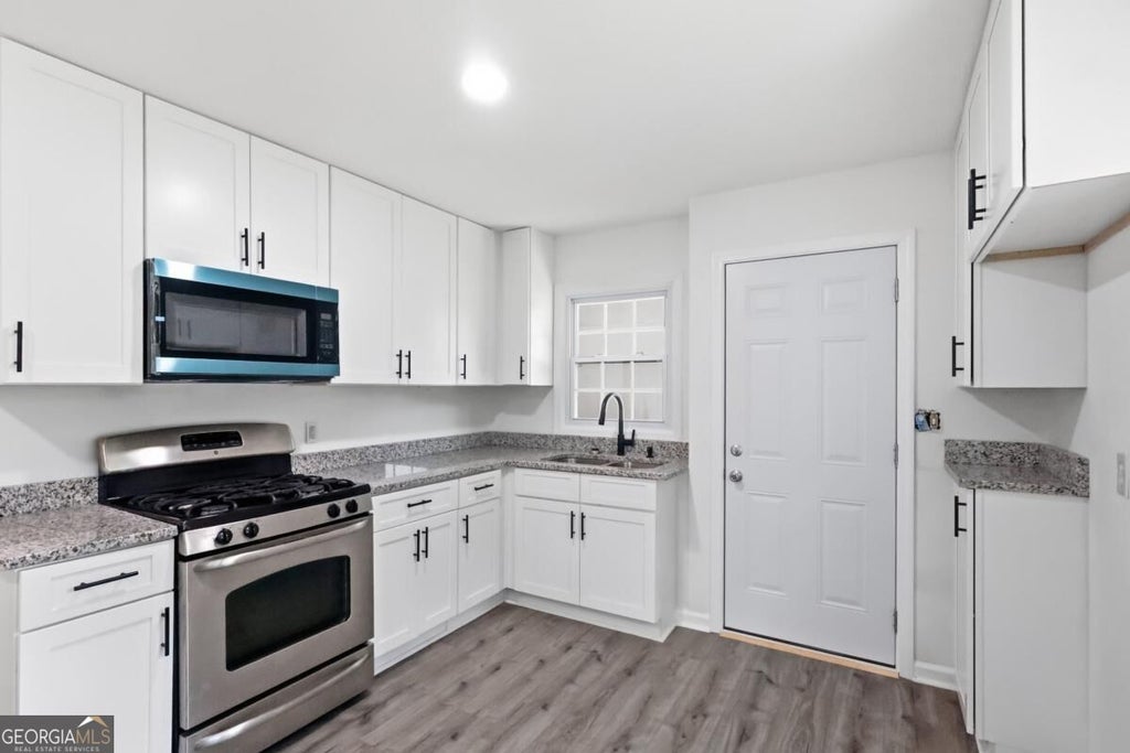 Photo of 8184 Laurel Drive SW, Covington, GA 30014 (MLS # 10877936)